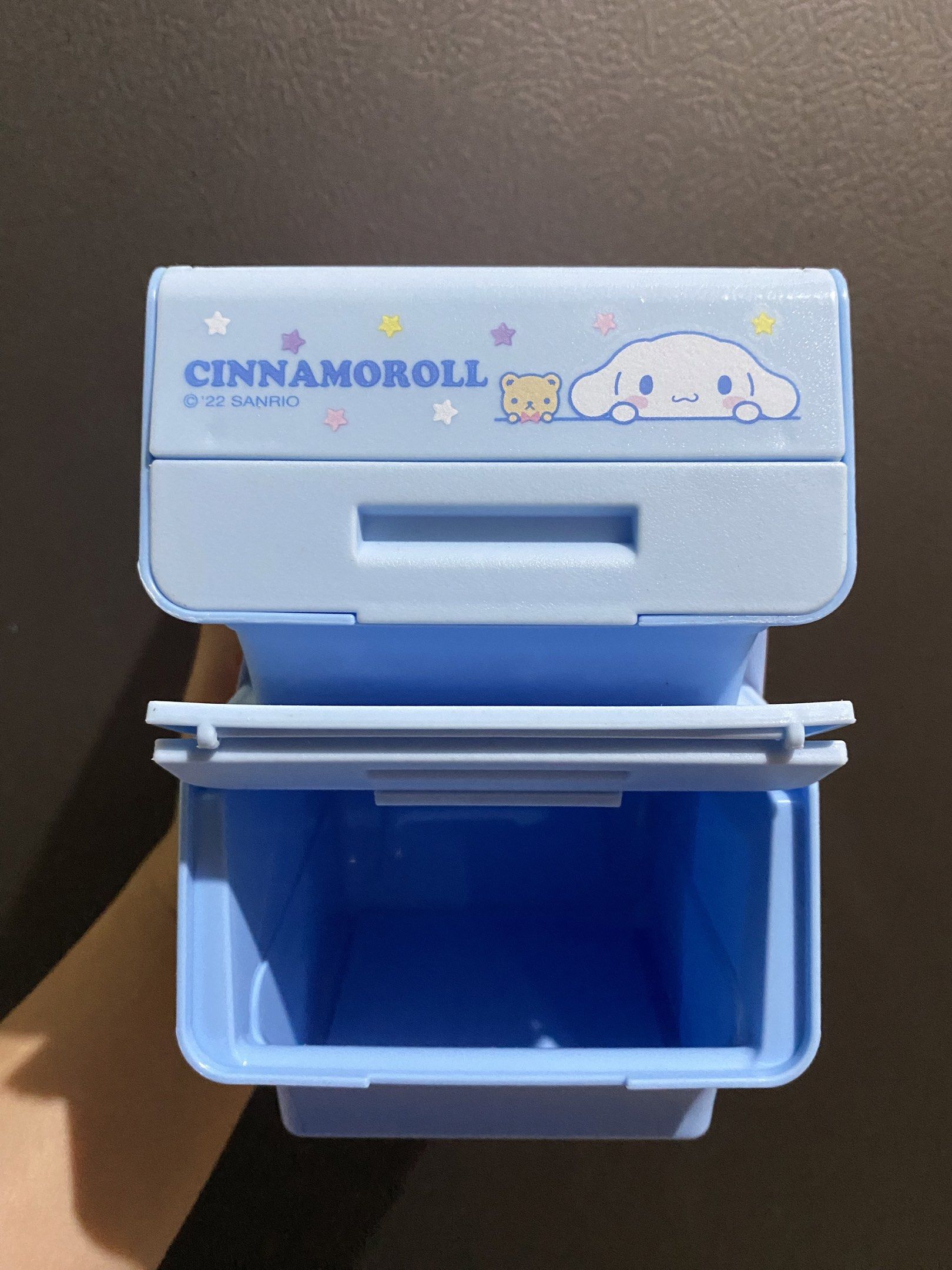 Cinnamoroll Mini Storage Box 2pcs Set (Category: Storage Boxes & Baskets) located in Calamba. Submitted by page_areumone1 (Listing ID 1420514123, Image 1). Description: - Adorable Cinnamoroll mini storage box. - Features a top compartment and a drawer. - Both are light blue. - Decorated with Cinnamoroll characters. - Includes the ©22 SANRIO logo. - Great for organizing small items on your desk or vanity..