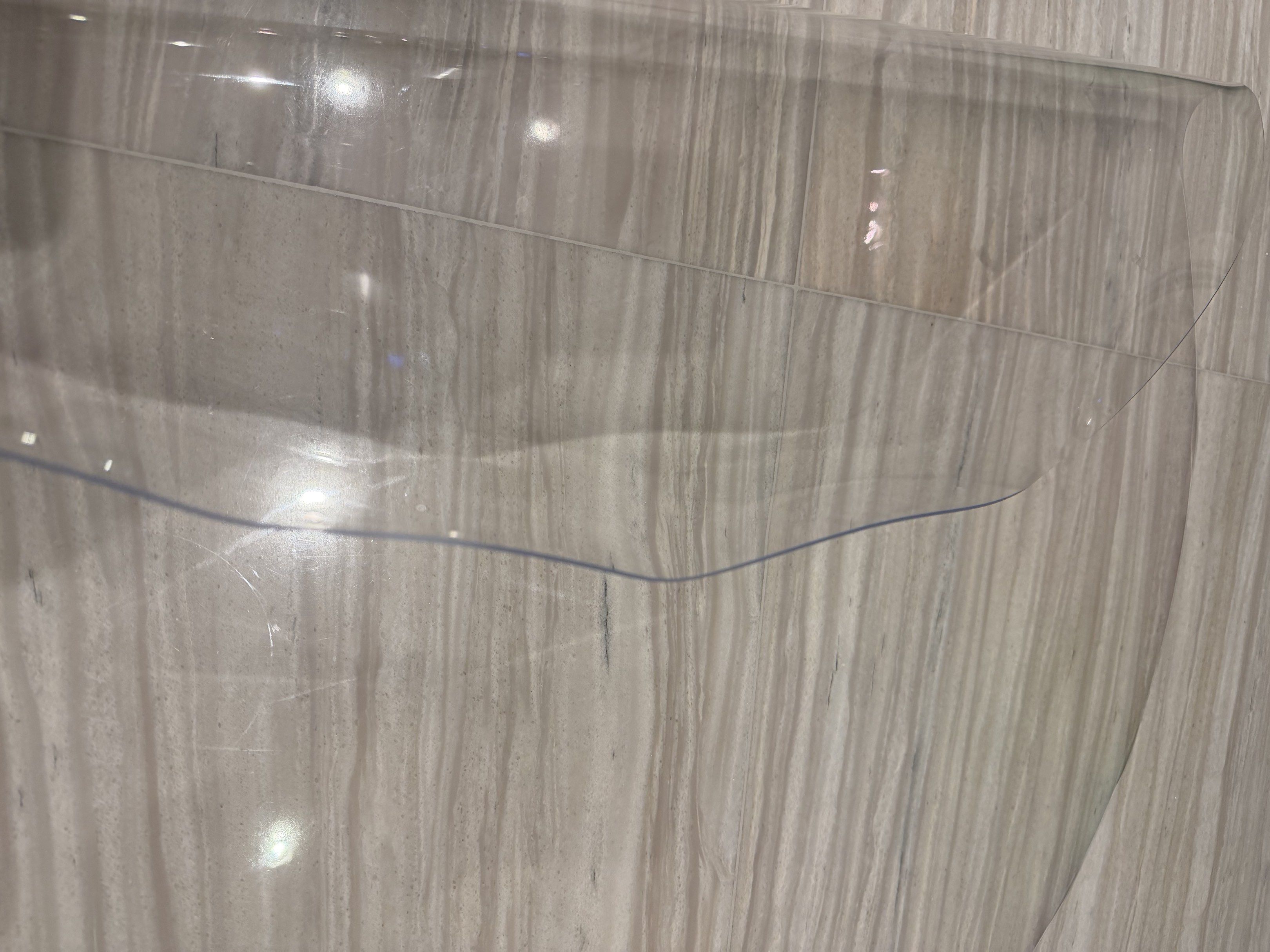 Clear Table Protector (Category: Tables & Sets) located in Singapore. Submitted by avasmileagain (Listing ID 1420474544, Image 3). Description: - Protects your table from scratches and spills. - Easy to clean and maintain. - Clear design preserves your table's look..