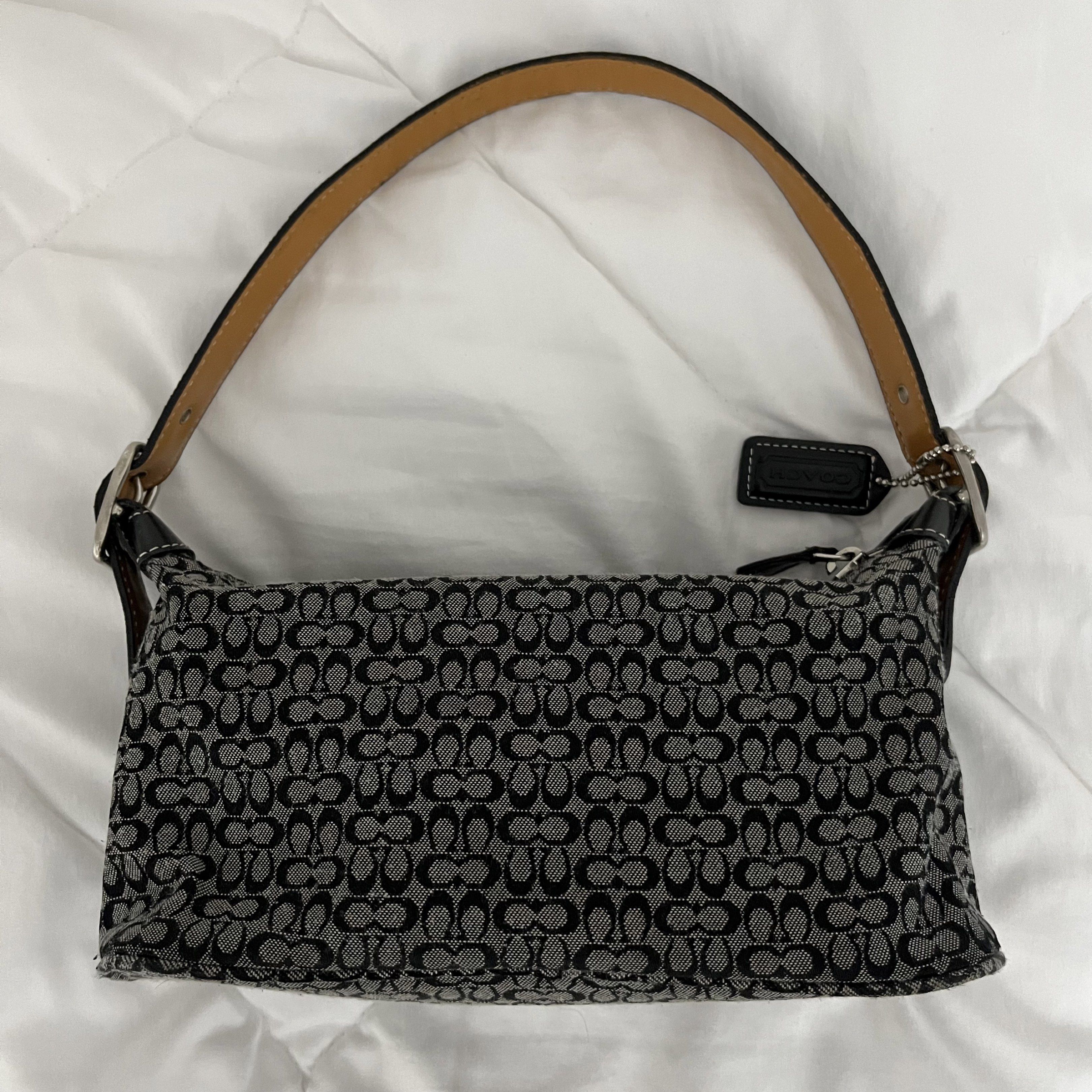 Coach Signature Shoulder Bag (Category: Luxury Bags & Wallets) located in Manila. Submitted by loliscloset (Listing ID 1420424426, Image 1). Description: - classic black/grey coach signature monogram canvas - silver-tone hardware - minor fraying on the bottom edge (barely noticeable) - interior and hardware still in nice shape - good condition no when-worn photos strictly no returns or refunds no cod payment: gcash courier: j&t or spx (sf shoulde