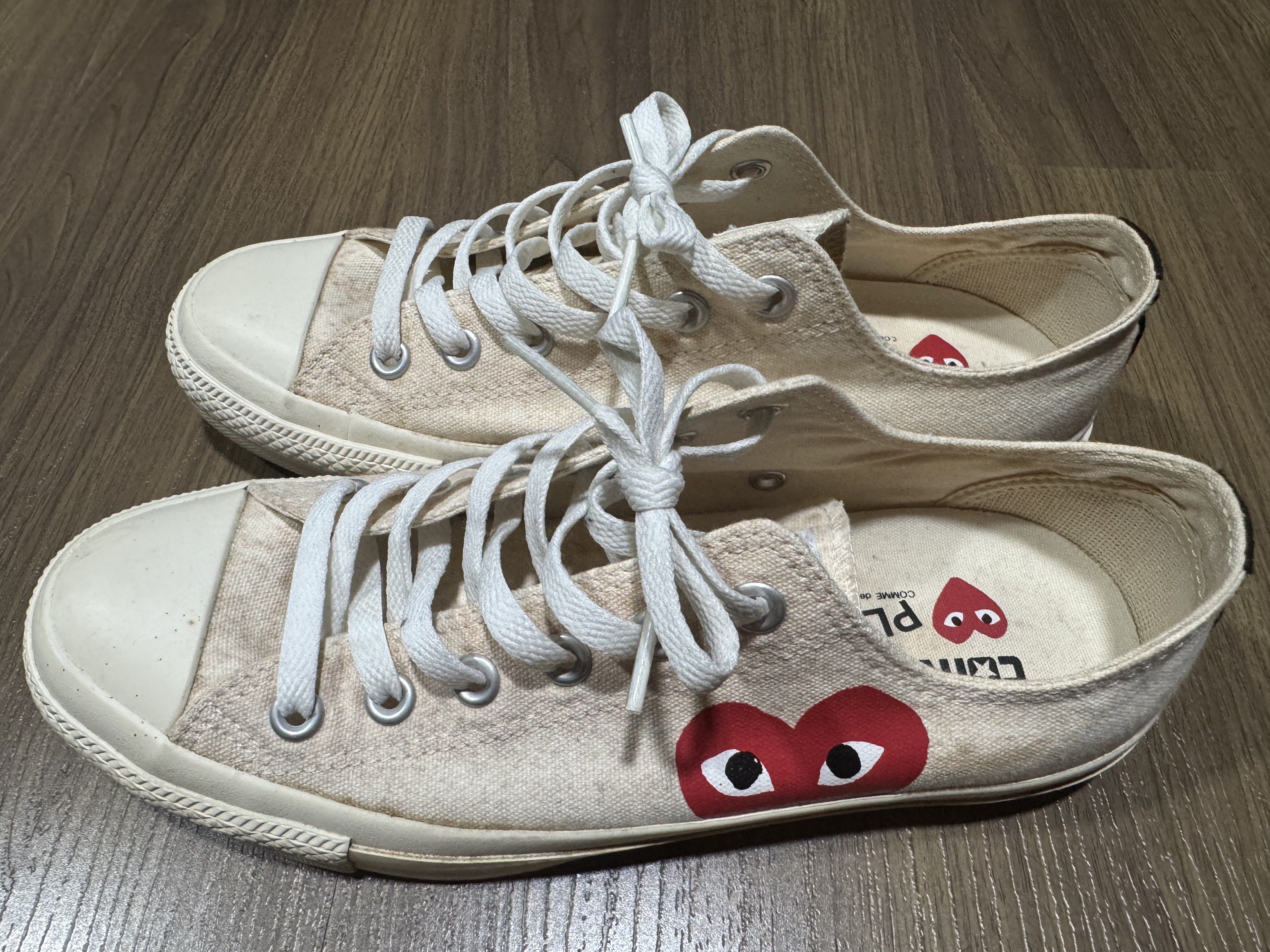 Converse x Comme des Garcons Play Sneakers (Category: Sneakers) located in Manila. Submitted by winder2cellar (Listing ID 1420440275, Image 1). Description: - Cream-colored Converse sneakers - Features the iconic Comme des Garcons Play heart logo - White laces and soles - Visible wear on soles - Converse and Play logos on insoles - Size clearly visible on sole - Authentic.