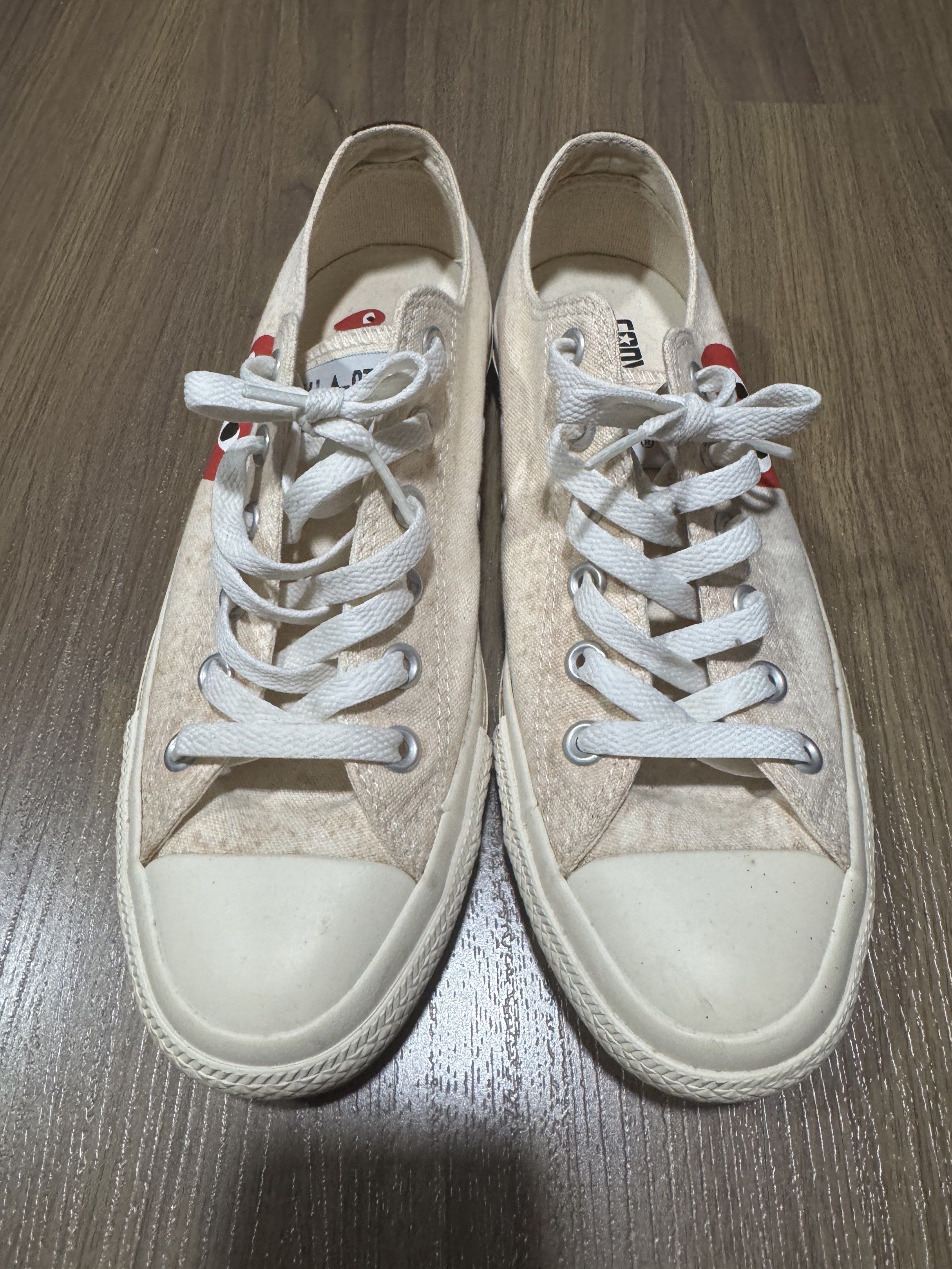 Converse x Comme des Garcons Play Sneakers (Category: Sneakers) located in Manila. Submitted by winder2cellar (Listing ID 1420440275, Image 2). Description: - Cream-colored Converse sneakers - Features the iconic Comme des Garcons Play heart logo - White laces and soles - Visible wear on soles - Converse and Play logos on insoles - Size clearly visible on sole - Authentic.