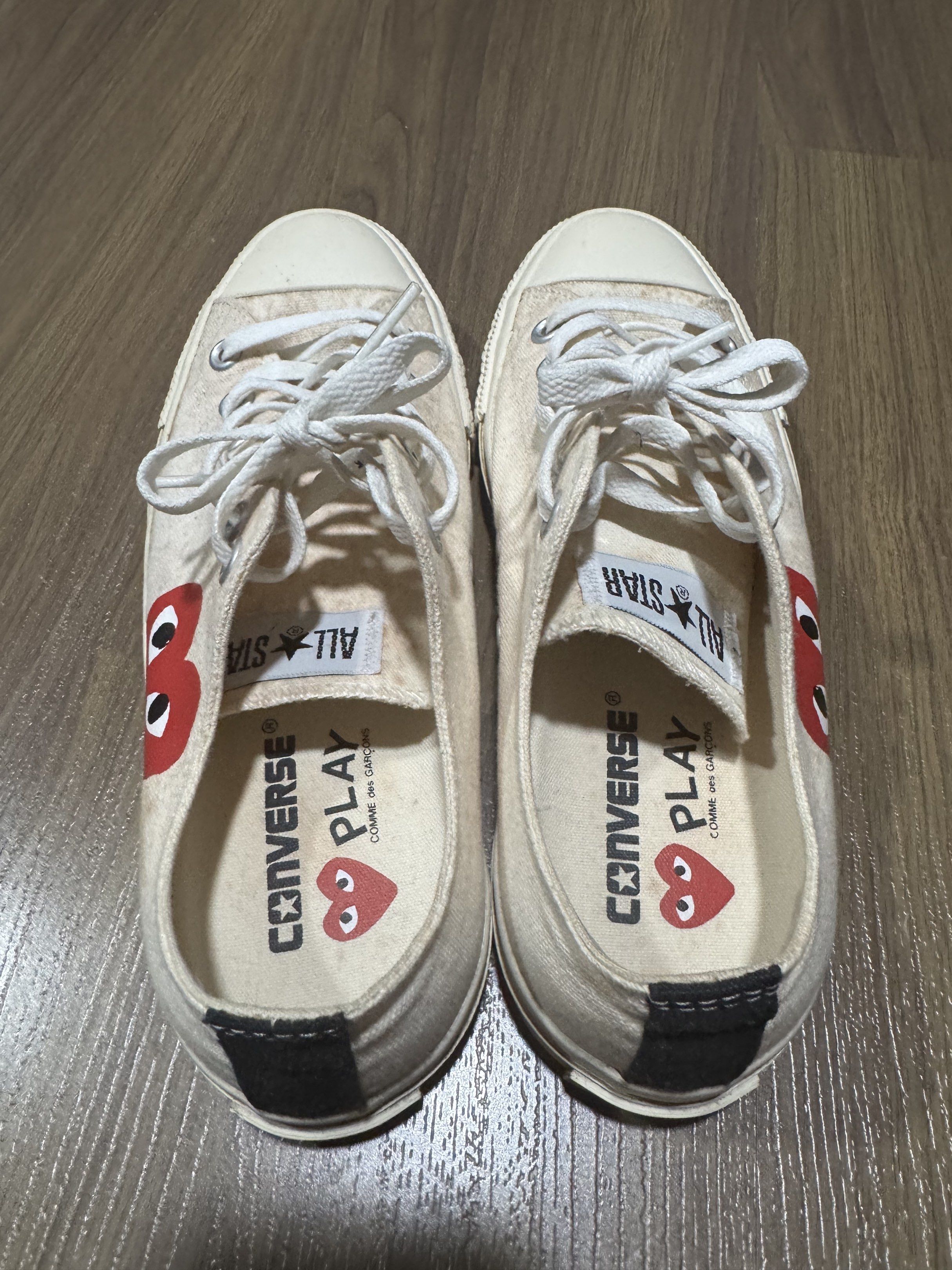 Converse x Comme des Garcons Play Sneakers (Category: Sneakers) located in Manila. Submitted by winder2cellar (Listing ID 1420440275, Image 3). Description: - Cream-colored Converse sneakers - Features the iconic Comme des Garcons Play heart logo - White laces and soles - Visible wear on soles - Converse and Play logos on insoles - Size clearly visible on sole - Authentic.