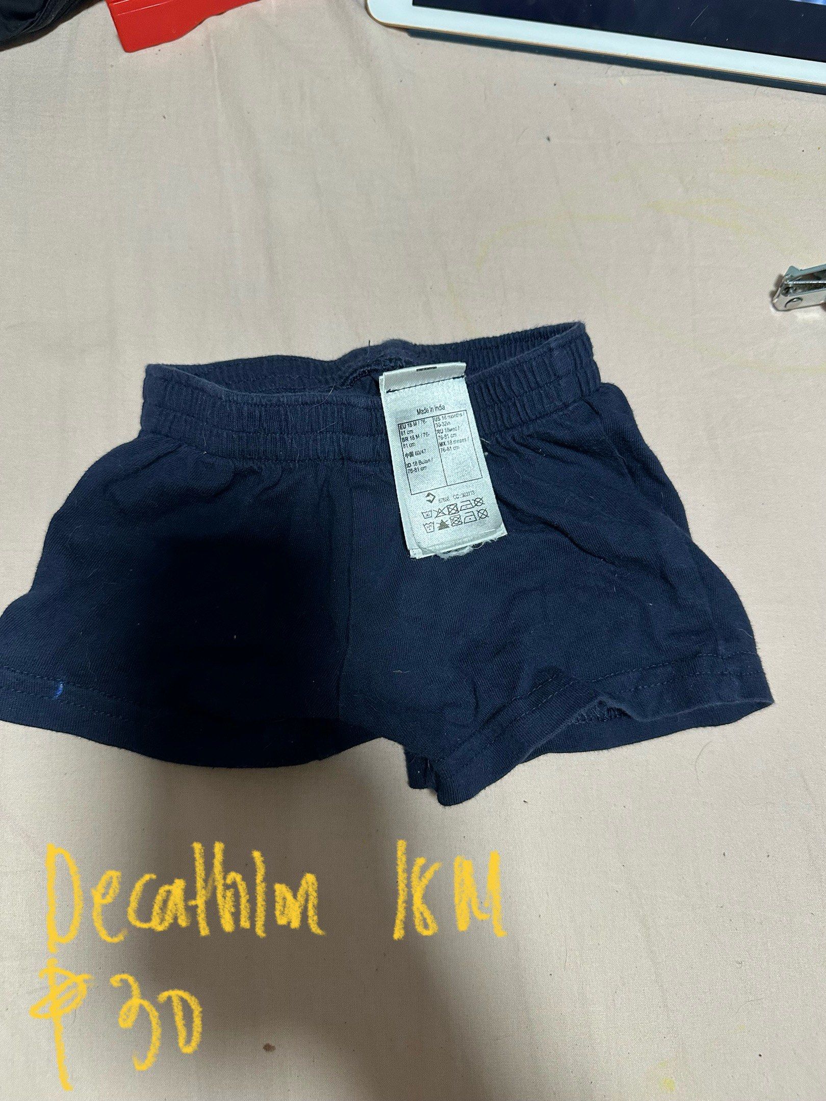 Decathlon Baby Shorts (Category: Babies & Kids Fashion) located in Manila. Submitted by tikismumsh (Listing ID 1420540616, Image 1). Description: - Navy blue baby shorts - Brand: Decathlon - Features an elastic waistband - Size: Not indicated - Made in India - Price: 30 pesos.