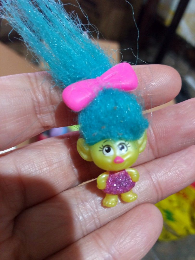 Dreamworks Trolls smidge Mini Figure (Category: Figurines & Statues) located in Marikina City. Submitted by picker_seller17 (Listing ID 1420524008, Image 1). Description: - Mini Trolls figure - Features blue hair and a pink bow - Yellow body with a pink glittery dress - Small, collectible size.