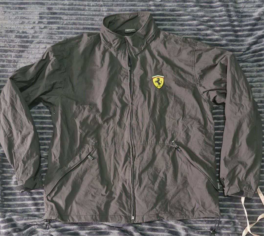 Ferrari jacket (Category: Coats, Jackets and Outerwear) located in Pili. Submitted by the_g_thrift (Listing ID 1420410100, Image 1). Description: ferrari jacket large on tag dimes: 25 x 28 very good condition not fade sa ilaw lang 9up/10 color rate issue: tinanggal pockable hood nya di halata tago naman sya .