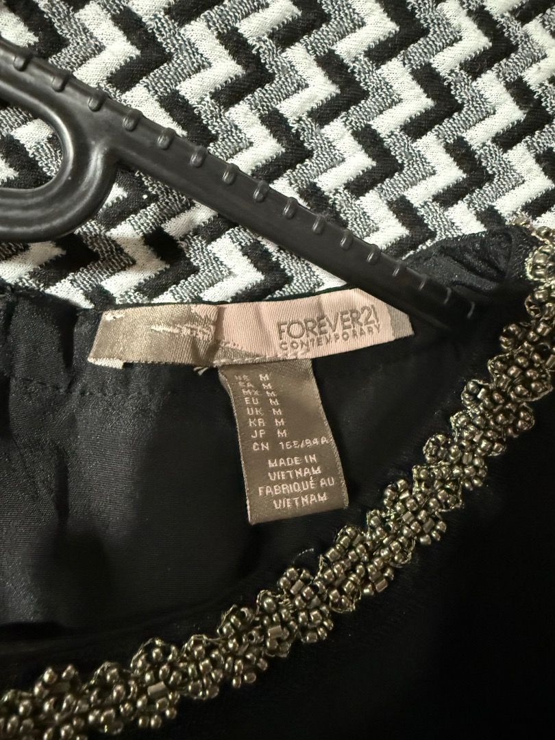 Forever21 dress (Category: Dresses) located in Paranaque City. Submitted by 10001thingstodeclutter (Listing ID 1420480336, Image 3). Description: Forever 21 dress with black top and printed skirt in one Beaded neckline detail Used once, good condition.