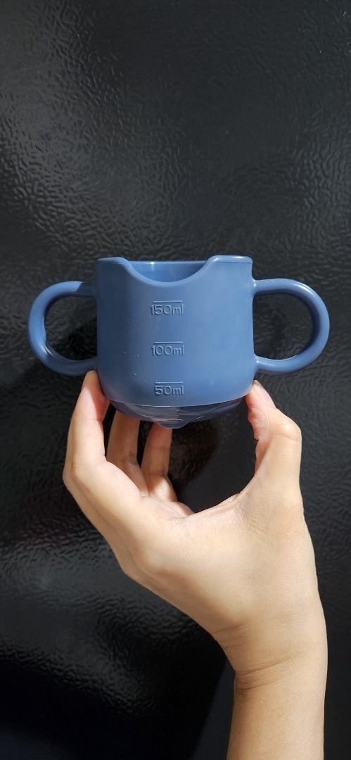 Haakaa Baby Drinking Cup (Category: Weaning & Toddler Feeding) located in Pasig City. Submitted by declutterwithmatt (Listing ID 1420471251, Image 2). Description: - Haakaa Baby Drinking Cup - Made from 100% silicone - Features easy-grip handles - Selling at 640+ on 🍊 app, and 750 in Rustan's.