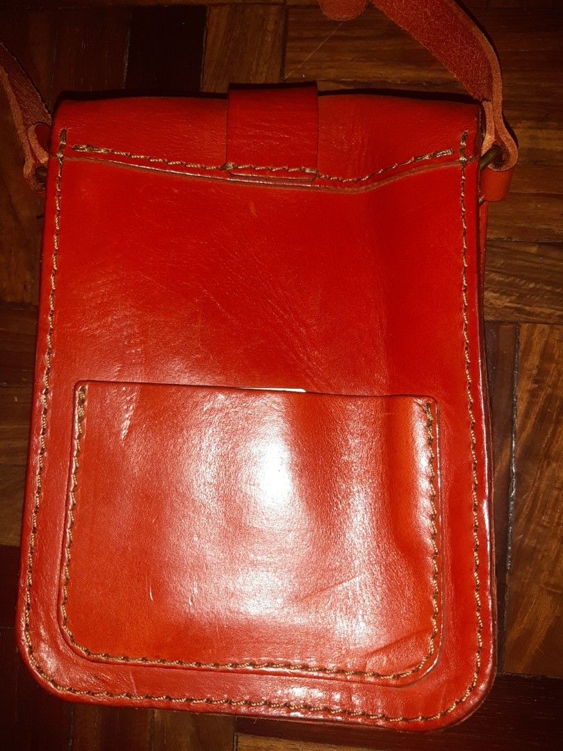 HERZ Classic Shoulder Bag CP-97 (Category: Luxury Bags & Wallets) located in Davao. Submitted by wonderwallnnipz_91 (Listing ID 1420528960, Image 3). Description: - Authentic HERZ shoulder bag - Genuine leather - Made in Japan - Classic design - Single belt closure - Rectangular shape with flap closure - Long shoulder strap - Single interior compartment -Color red -Artisan Handmade Good condition actual Measurements: 6.6 inches x 8.2 inches x 2.1