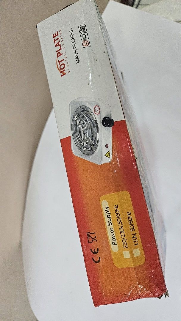 Hot Plate Electric Cooking JX-1010B (Category: Other Kitchenware & Tableware) located in Quezon City. Submitted by brigdog (Listing ID 1420435876, Image 3). Description: Electric hot plate for cooking. Model JX-1010B. It has a 1000W power output. The power supply is 220/230V, 50/60Hz and 110V, 50/60Hz. Made in China. It has a single heating coil and a control knob. The hot plate is white..