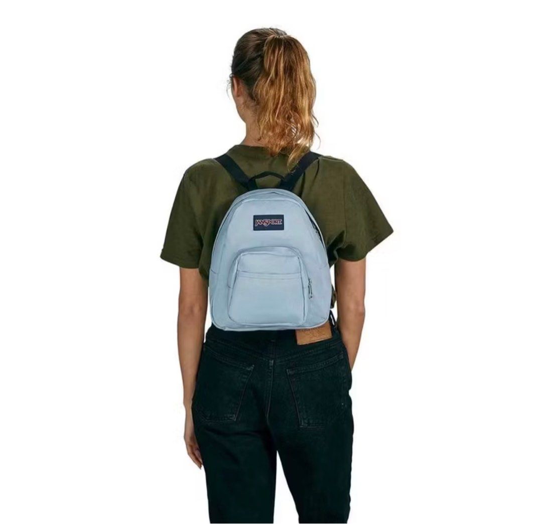 Jansport Mini Backpack - Light Blue (Category: Backpacks) located in Manila. Submitted by xxxmjayne (Listing ID 1420476495, Image 2). Description: - Light blue Jansport mini backpack - Main compartment - Front zippered pocket - Black straps - Top handle - Jansport logo visible - Mini size, ideal for daily essentials.