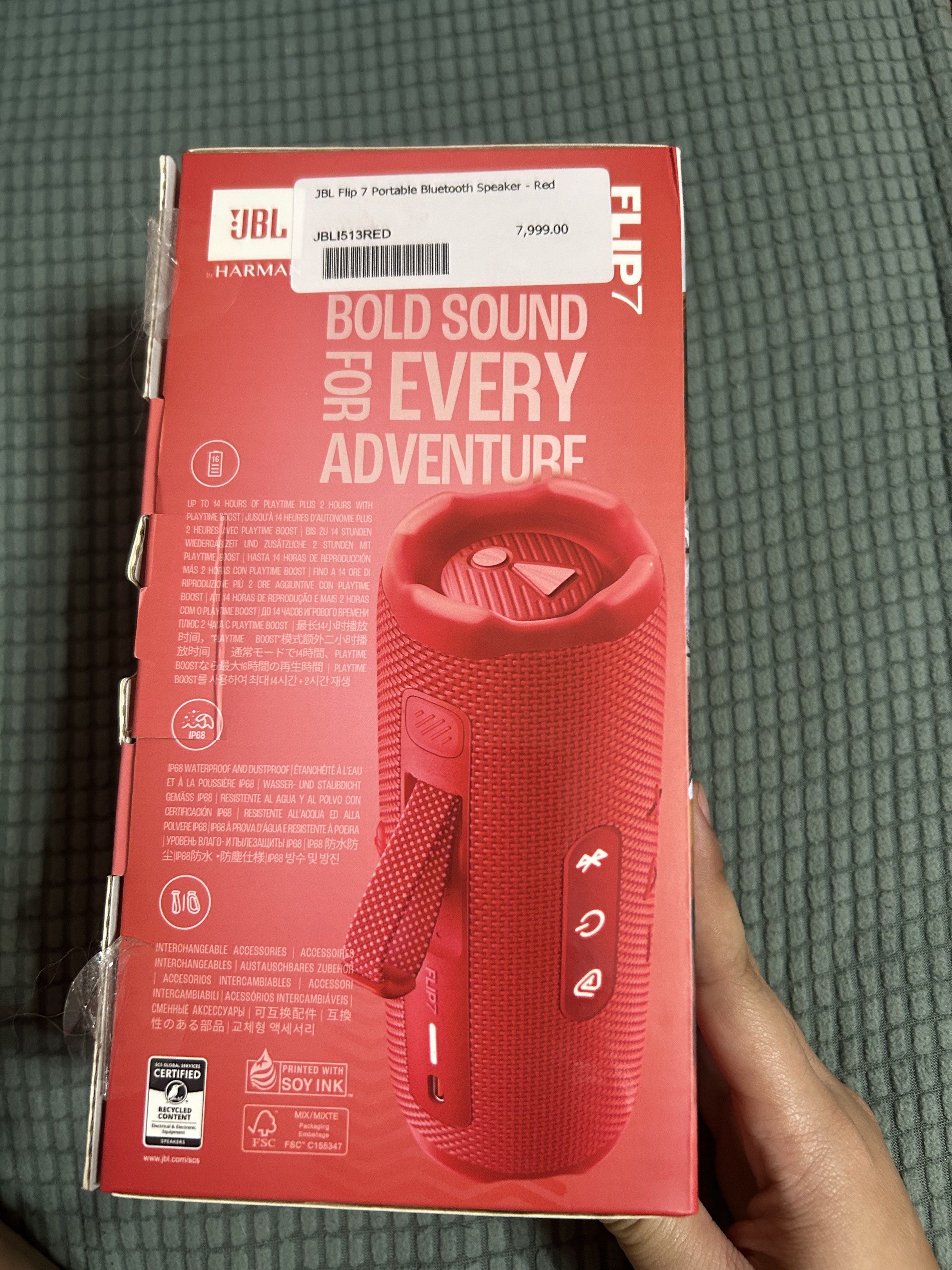 JBL Flip 7 Portable Bluetooth Speaker - Red (Category: Soundbars, Speakers & Amplifiers) located in Cagayan de Oro. Submitted by kxrylle (Listing ID 1420553722, Image 2). Description: JBL Flip 7 is a portable Bluetooth speaker in red. It features Bluetooth v5.4 and has a 16-hour battery life. The speaker has a USB-C port for charging and includes controls for power, Bluetooth pairing, and volume. The box indicates it is waterproof and dustproof..