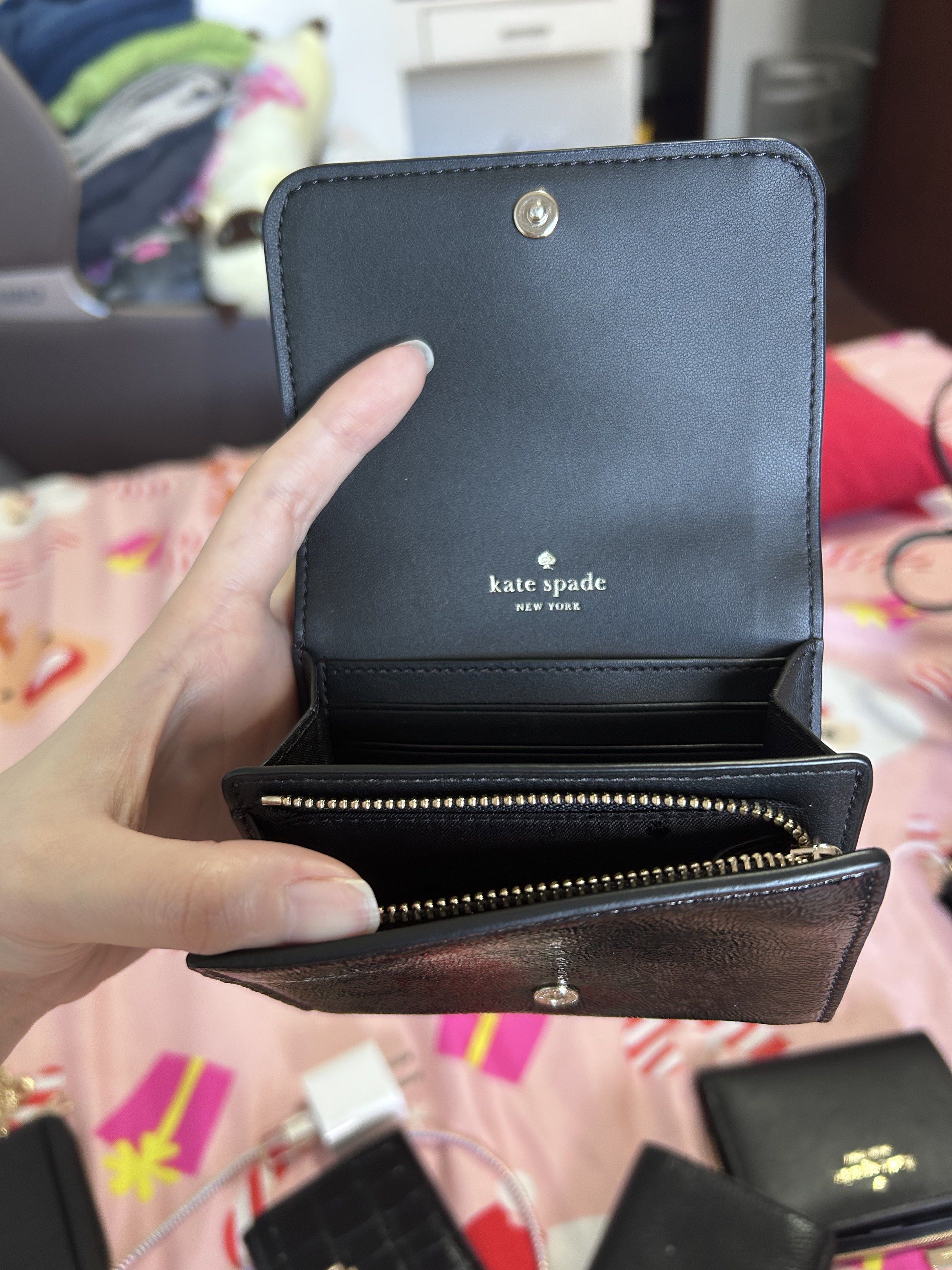 Kate Spade Black Crinkle Patent Wallet (Category: Luxury Bags & Wallets) located in Muntinlupa City. Submitted by piayo (Listing ID 1420419540, Image 2). Description: - Authentic Kate Spade wallet - Black crinkle patent leather - Snap closure - Zippered coin compartment - Multiple card slots - Bill compartment - Kate Spade New York logo embossed inside - Brand new with original price tag.