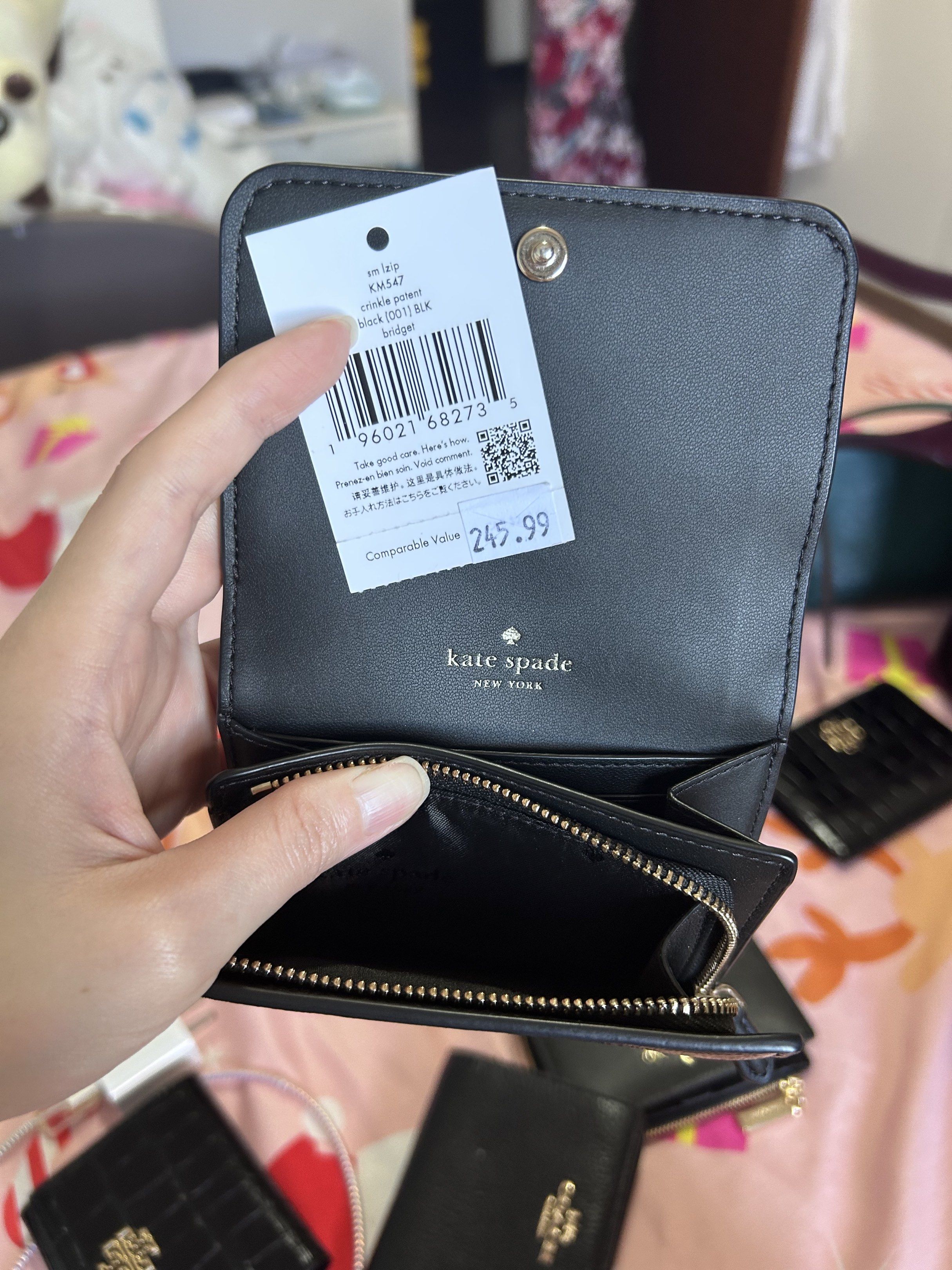 Kate Spade Black Crinkle Patent Wallet (Category: Luxury Bags & Wallets) located in Muntinlupa City. Submitted by piayo (Listing ID 1420419540, Image 3). Description: - Authentic Kate Spade wallet - Black crinkle patent leather - Snap closure - Zippered coin compartment - Multiple card slots - Bill compartment - Kate Spade New York logo embossed inside - Brand new with original price tag.