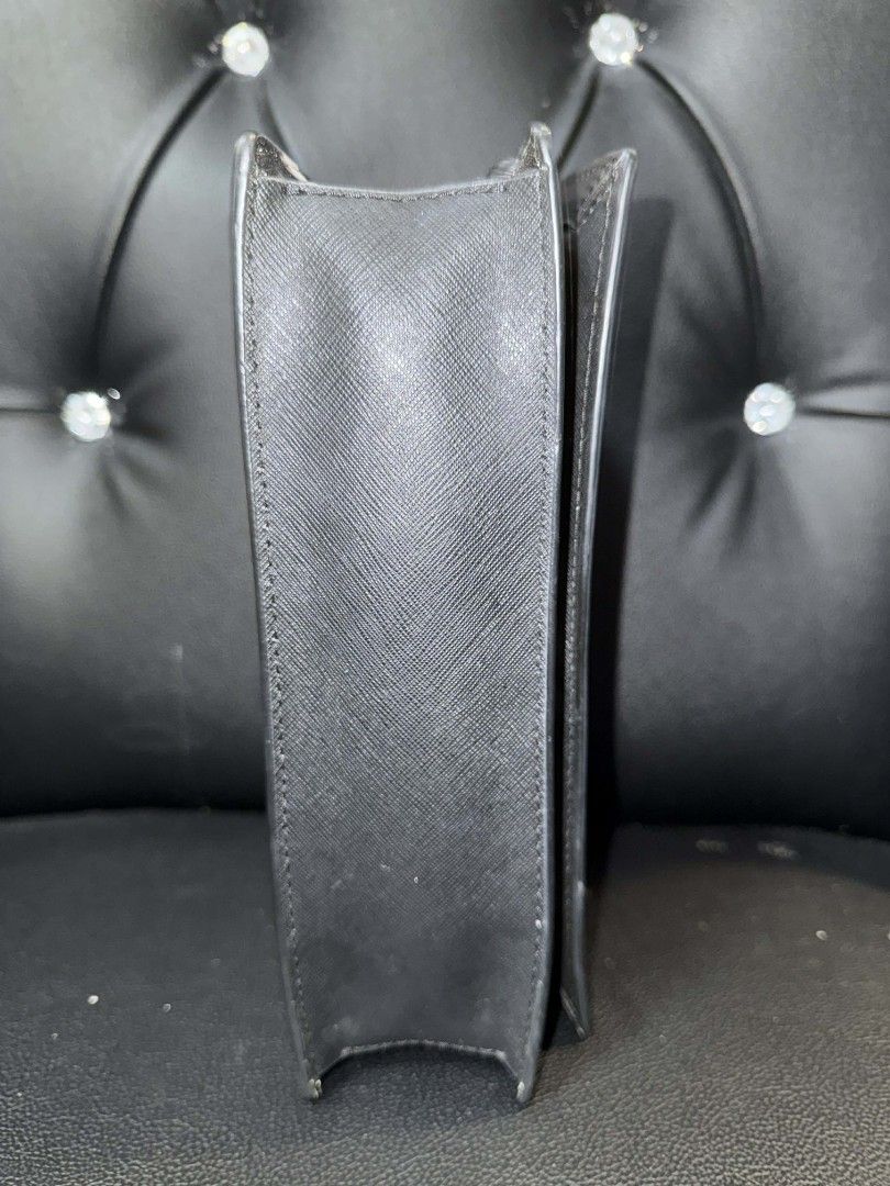 Kate Spade Polka Dot Chain/Sling Bag (Category: Luxury Bags & Wallets) located in Mandaluyong City. Submitted by lemonade12012021 (Listing ID 1420370480, Image 3). Description: - Kate Spade wallet-on-chain bag - Black and white polka dot design - Chain strap - Flap closure - Black side, polka dot back - Kate Spade logo on front.