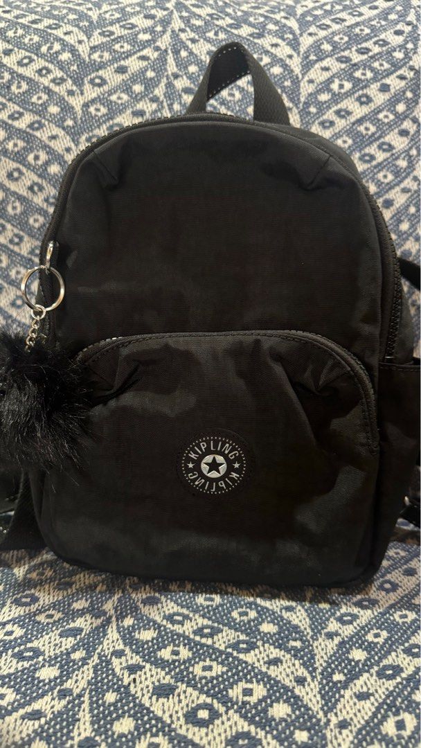Kipling Zinna Backpack - Black (Category: Backpacks) located in Caloocan City. Submitted by cyy.declutter (Listing ID 1420395729, Image 1). Description: Authentic Kipling Zinna backpack Measurements: 7.75”W x 4”H x 11”D Color: Black Features: - Front zippered pocket - Main compartment with Kipling logo - Adjustable straps - Top handle - Includes small keychain accessory - Brand new with original tags - Still in original packaging SRP: 7,500 RFS: 