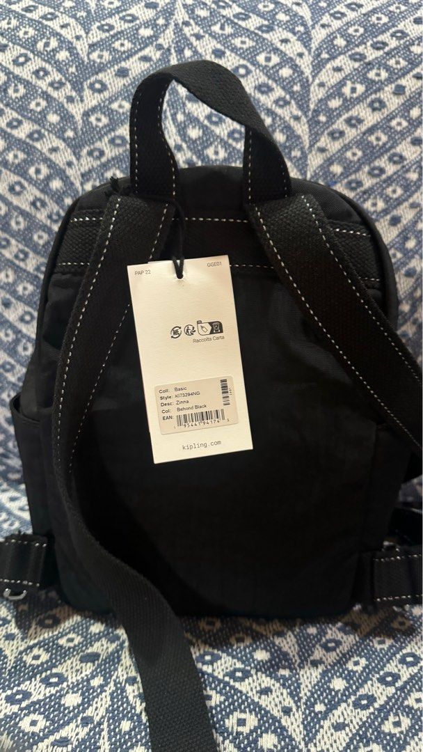 Kipling Zinna Backpack - Black (Category: Backpacks) located in Caloocan City. Submitted by cyy.declutter (Listing ID 1420395729, Image 2). Description: Authentic Kipling Zinna backpack Measurements: 7.75”W x 4”H x 11”D Color: Black Features: - Front zippered pocket - Main compartment with Kipling logo - Adjustable straps - Top handle - Includes small keychain accessory - Brand new with original tags - Still in original packaging SRP: 7,500 RFS: 