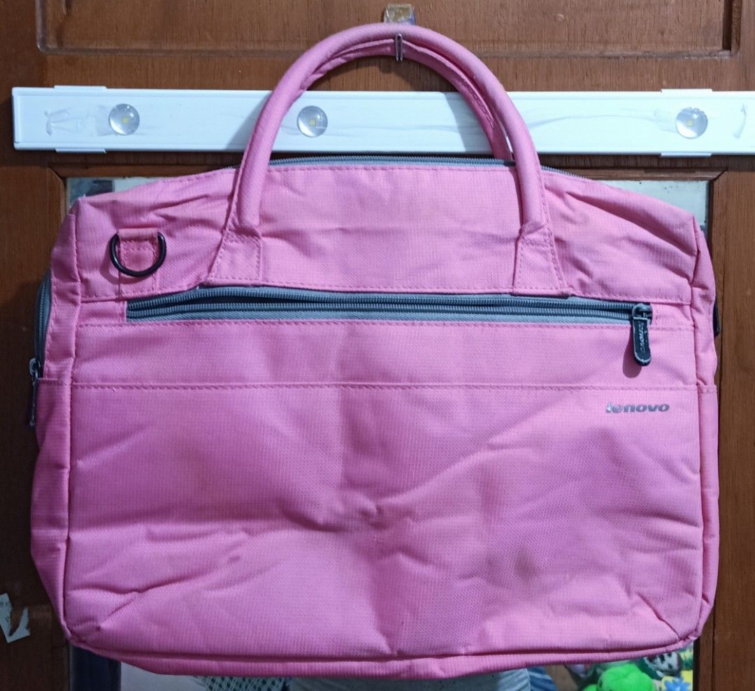 Lenovo Pink Laptop Bag (Category: Laptop Bags & Sleeves) located in Quezon City. Submitted by daisyuy1979 (Listing ID 1420453343, Image 1). Description: - Pink Lenovo laptop bag - Top handle and shoulder strap - Main compartment with zipper closure - Additional front pocket - Dark grey interior lining - Lenovo logo on the front.