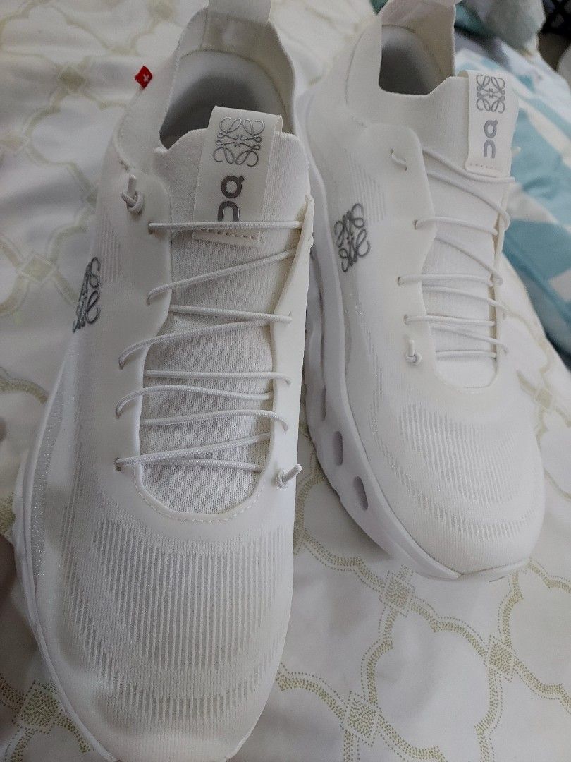 Loewe x On Cloudtilt All White Sneakers (Category: Sneakers) located in Paranaque City. Submitted by andim8 (Listing ID 1420435176, Image 1). Description: - Loewe x On Cloudtilt sneakers - All-white colorway - Size 41 - Features Loewe logo - Includes original box, extra laces, and dust bag - Unique sole design - Unworn condition bnew bought from Loewe stor in Ion Orchard never used complete with box dustbags and extra shoelace fits womens 9.5 to 