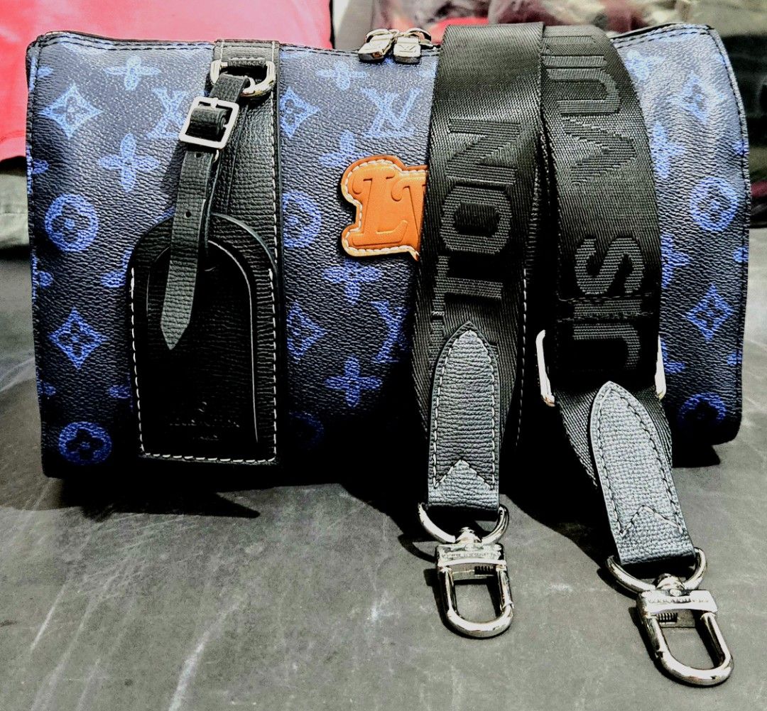Louis Vuitton Blue Monogram Travel Bag (Category: Luxury Bags & Wallets) located in Quezon City. Submitted by dara020533 (Listing ID 1420385524, Image 2). Description: - Blue monogram travel bag - Top handle and detachable shoulder strap - Includes luggage tag - Features brand logo leather patch - Silver-tone hardware - Zip closure.
