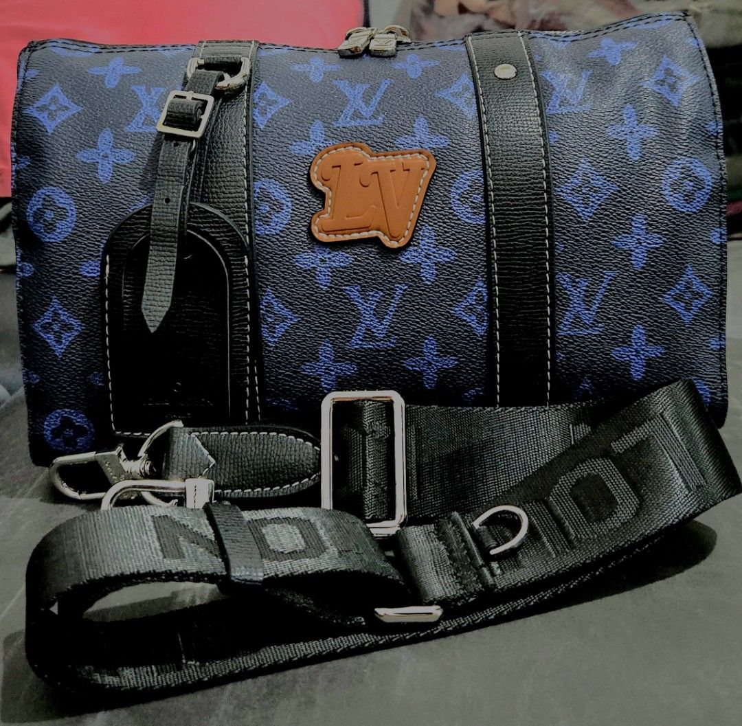 Louis Vuitton Blue Monogram Travel Bag (Category: Luxury Bags & Wallets) located in Quezon City. Submitted by dara020533 (Listing ID 1420385524, Image 1). Description: - Blue monogram travel bag - Top handle and detachable shoulder strap - Includes luggage tag - Features brand logo leather patch - Silver-tone hardware - Zip closure.