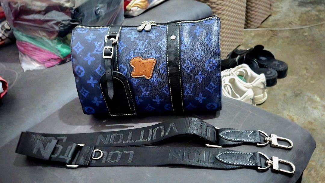 Louis Vuitton Blue Monogram Travel Bag (Category: Luxury Bags & Wallets) located in Quezon City. Submitted by dara020533 (Listing ID 1420385524, Image 3). Description: - Blue monogram travel bag - Top handle and detachable shoulder strap - Includes luggage tag - Features brand logo leather patch - Silver-tone hardware - Zip closure.