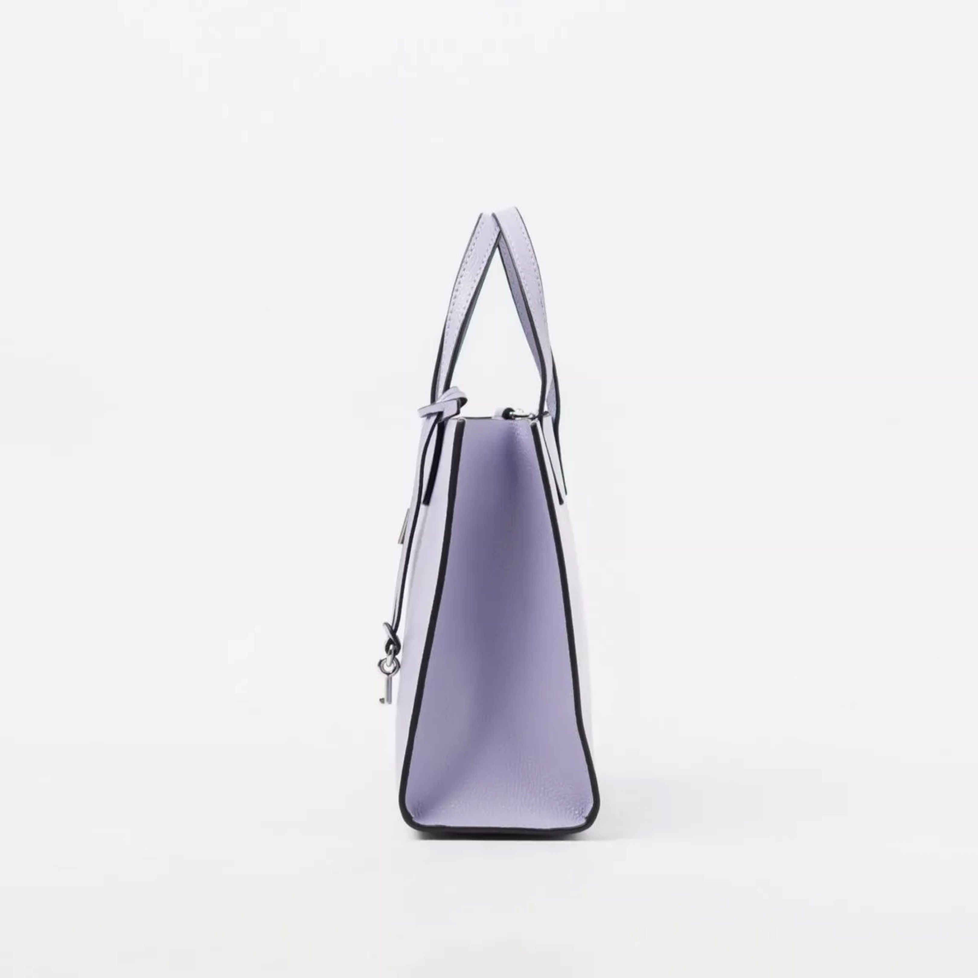 Marc Jacobs The Box Bag (Category: Luxury Bags & Wallets) located in Manila. Submitted by poorstazy (Listing ID 1420500685, Image 2). Description: - Authentic Marc Jacobs handbag - Light purple color - Structured design - Top handle and detachable shoulder strap - Rectangular shape - Zip closure with lock detail - Textured material - Features the Marc Jacobs logo.