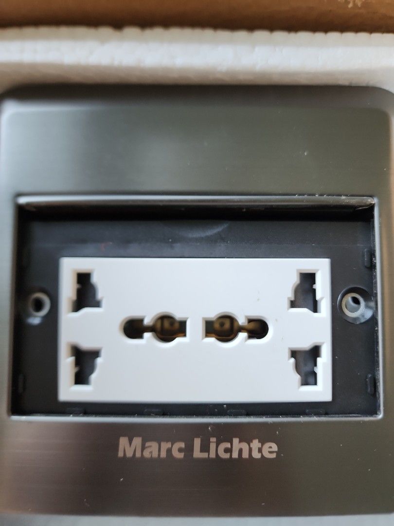 Marc Lichte Universal Power Socket (Category: Electrical, Adaptors & Sockets) located in Singapore. Submitted by yellowdollyear (Listing ID 1420352921, Image 3). Description: Brand new Marc Lichte universal power socket. Features a sleek silver design. The socket is designed to fit multiple plug types. Perfect for home or office use. Comes in original packaging..