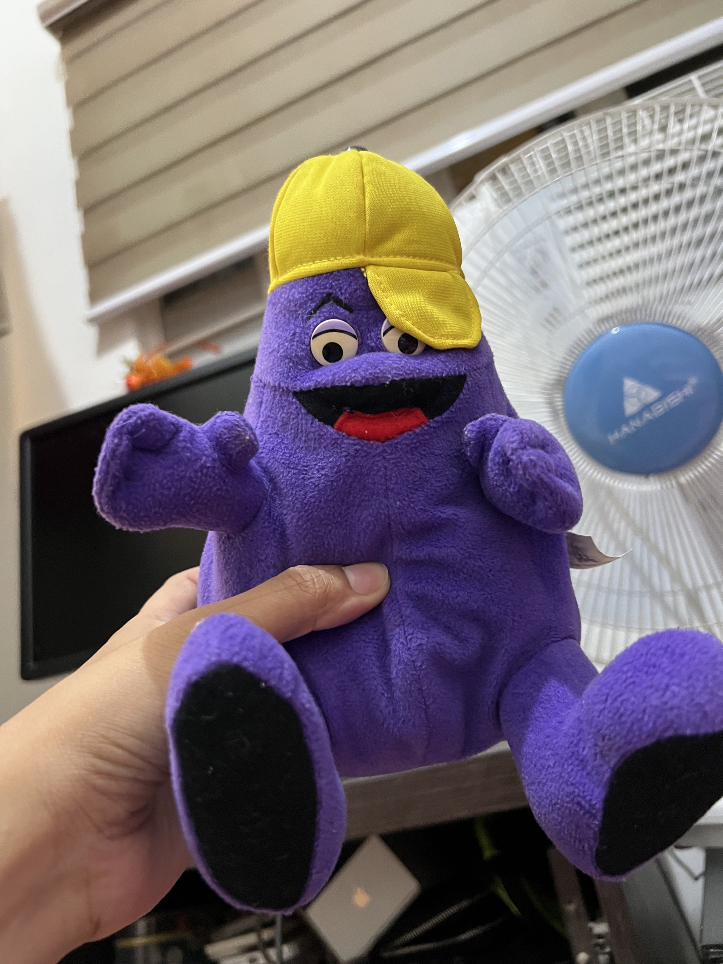 McDonald's Grimace Plush Toy 1997 (Category: Plushies & Soft Toys) located in Taguig. Submitted by rarecollections101922 (Listing ID 1420445835, Image 1). Description: - Authentic Grimace plush toy from McDonald's - Features a vibrant purple body - Includes a classic yellow cap - Designed with black feet - Ideal for McDonald's and plush toy enthusiasts.