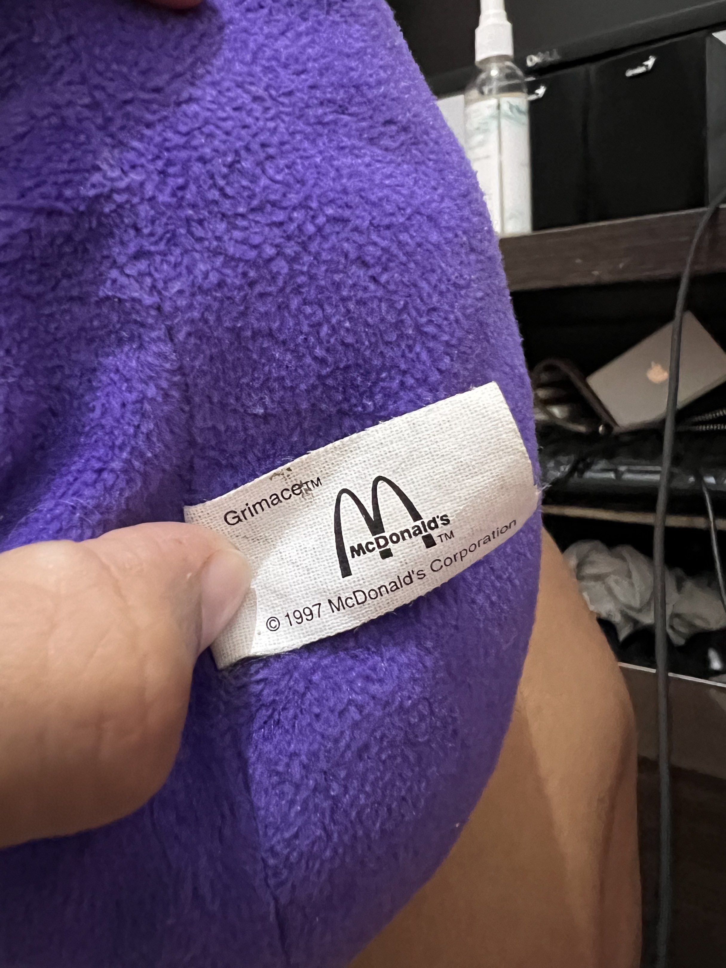 McDonald's Grimace Plush Toy 1997 (Category: Plushies & Soft Toys) located in Taguig. Submitted by rarecollections101922 (Listing ID 1420445835, Image 2). Description: - Authentic Grimace plush toy from McDonald's - Features a vibrant purple body - Includes a classic yellow cap - Designed with black feet - Ideal for McDonald's and plush toy enthusiasts.