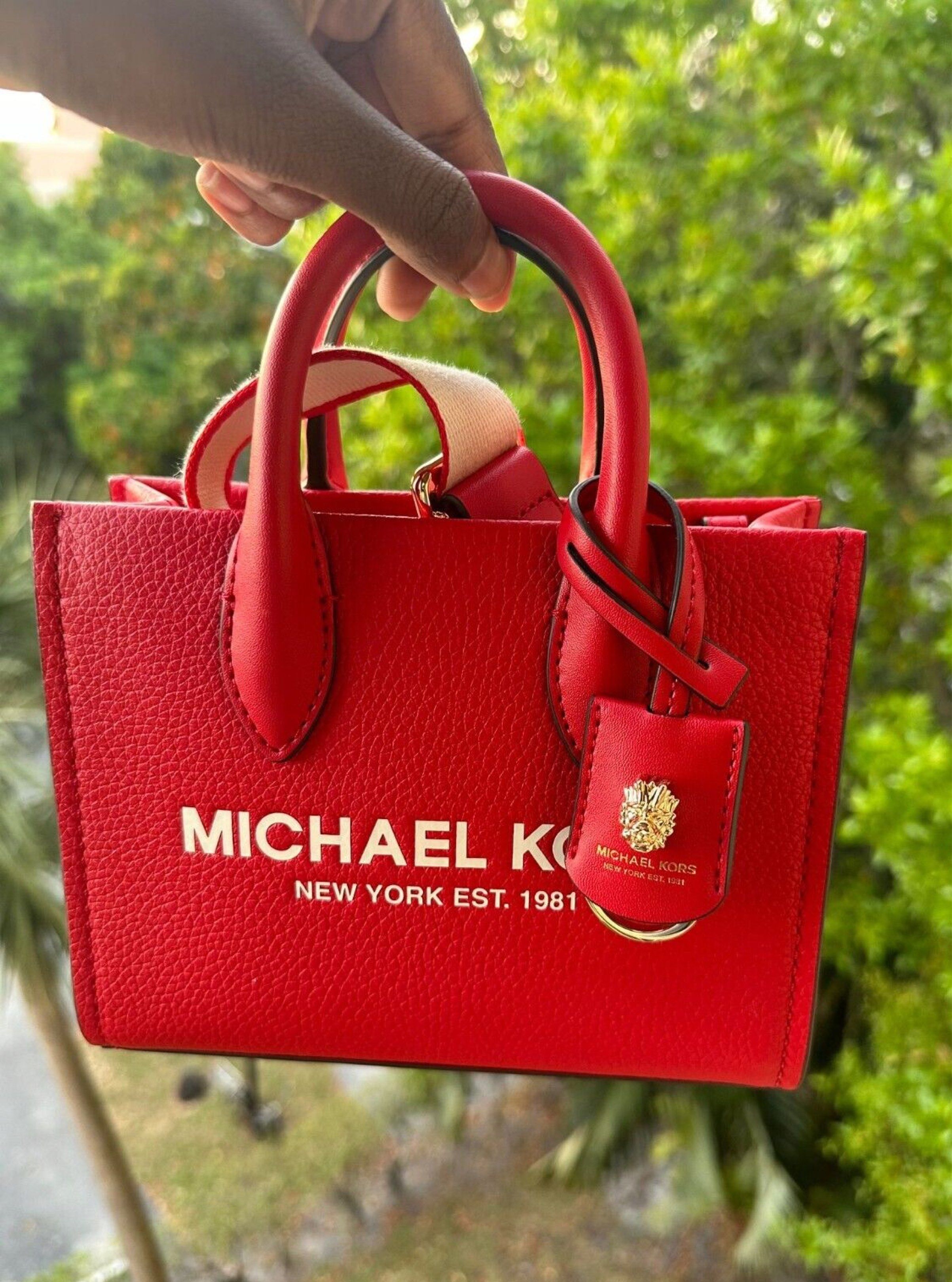 Michael Kors Red Tote Bag (Category: Luxury Bags & Wallets) located in Manila. Submitted by lovieauthenticmerchandise (Listing ID 1420492811, Image 2). Description: - Authentic Michael Kors tote bag - Vibrant red color - Top handle and detachable shoulder strap - Features the iconic Michael Kors logo - Compact size, ideal for everyday use.