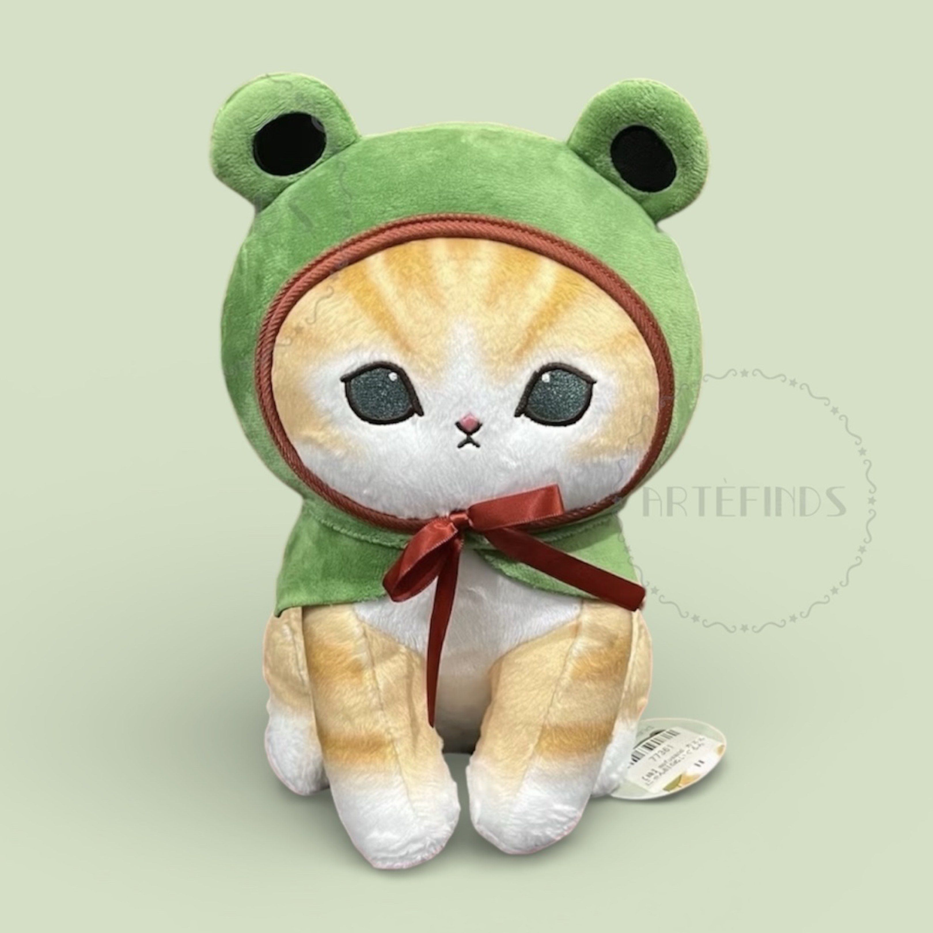 Mofusand Cat Plush - Frog Costume (Category: Plushies & Soft Toys) located in Pasig City. Submitted by pinkfluff17 (Listing ID 1417000109, Image 1). Description: Adorable Mofusand cat plushies in frog costumes! Available in two colors: orange tabby with a green frog hood and grey tabby with a yellow frog hood. Each plush features a cute cat face peeking out from the hood and a small bow. Perfect for cat lovers and collectors..