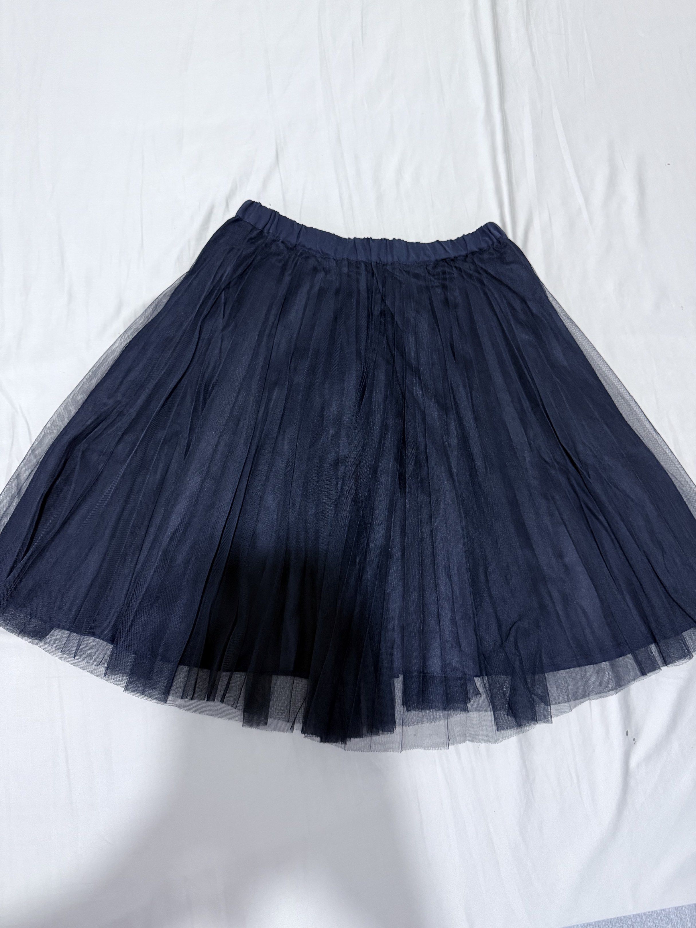 Navy Blue Tulle Skirt (Category: Skirts) located in Mansalay. Submitted by declutterandco (Listing ID 1420493501, Image 2). Description: - Navy blue tulle skirt - Comfortable elastic waistband - Pleated design for a full silhouette - Lightweight and airy fabric - Suitable for casual and dressy wear.