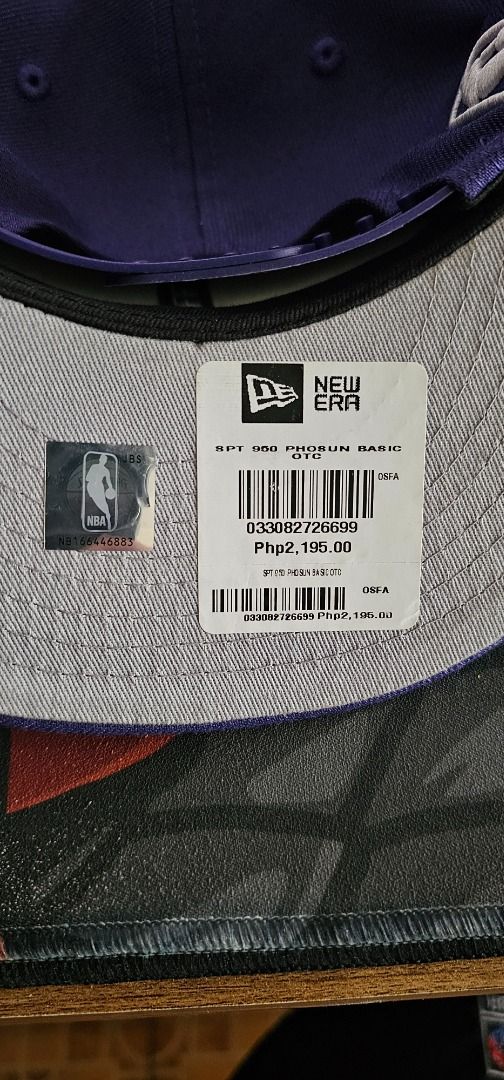 New Era 9Fifty Phoenix Suns Snapback Cap (Category: Caps & Hats) located in Pasay City. Submitted by bs_flatline (Listing ID 1420404916, Image 2). Description: - Official New Era 9Fifty cap - Phoenix Suns logo - Color: Purple with grey underbrim - NBA logo on the side - Adjustable snapback closure - Original New Era tag attached Bnew as displayed only on Shop. NO box. Cap only.
