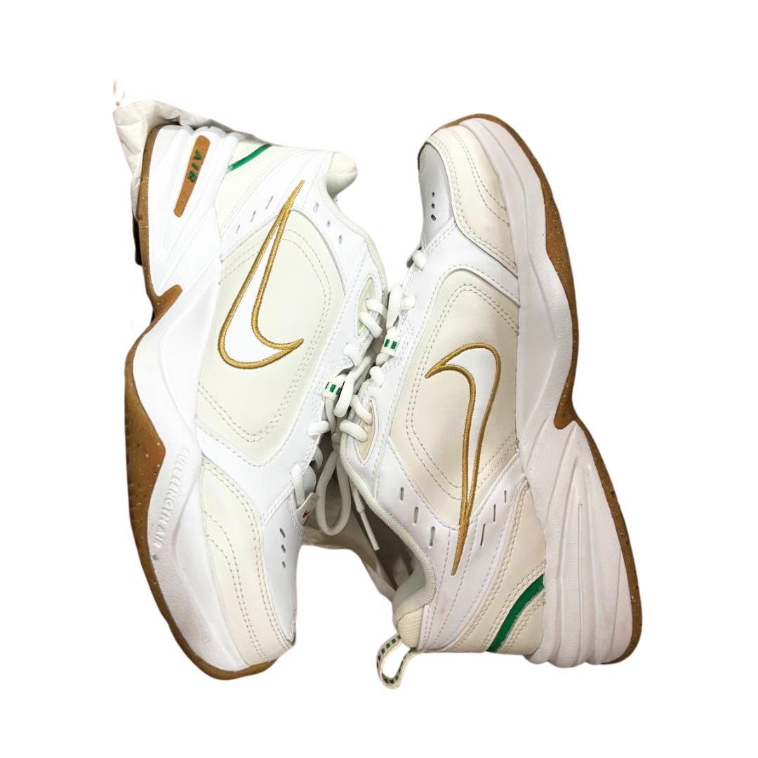 Nike Air Monarch IV White Gold (Category: Sneakers) located in Cainta. Submitted by declutteringceo (Listing ID 1420553564, Image 1). Description: - Nike Air Monarch IV sneakers - White leather upper - Gold swoosh and green detailing - White and brown sole - Lace-up closure - Nike Air logo on heel.