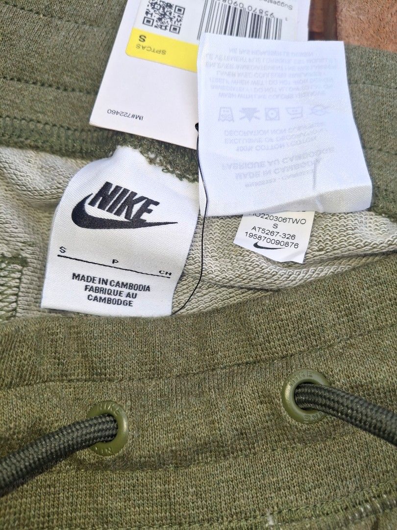 Nike Alumni Shorts - Olive Green (Category: Shorts) located in Bayambang. Submitted by ace_found_it_06 (Listing ID 1420360820, Image 3). Description: - Authentic Nike Sportswear Club Shorts - Olive green color - Size S - Features Nike logo - Drawstring waistband for adjustable fit - Made in Cambodia - New with tags - Perfect for casual wear and workouts - Measurements in images - Dimes : 28-33 x 21.