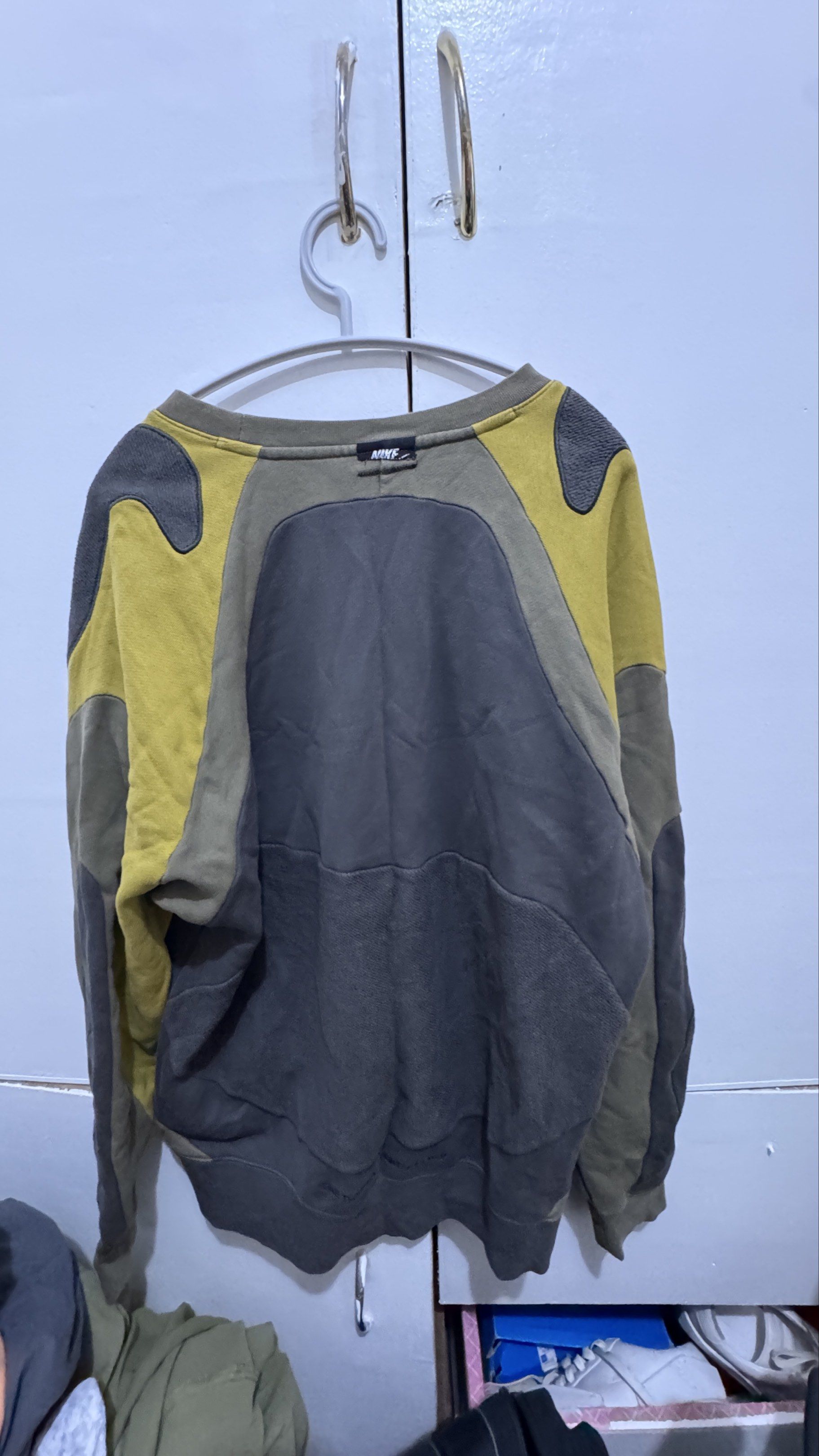 Nike Colorblock Sweatshirt XL (Category: Coats, Jackets and Outerwear) located in Manila. Submitted by offthehype (Listing ID 1420440333, Image 2). Description: - Nike colorblock sweatshirt - Size: XL - Colors: Olive green, yellow, and gray - Design: Color-blocked panels - Features Nike logo on chest and back - Style: Crew neck, long sleeves - Made in China - Boxy cropped fit.