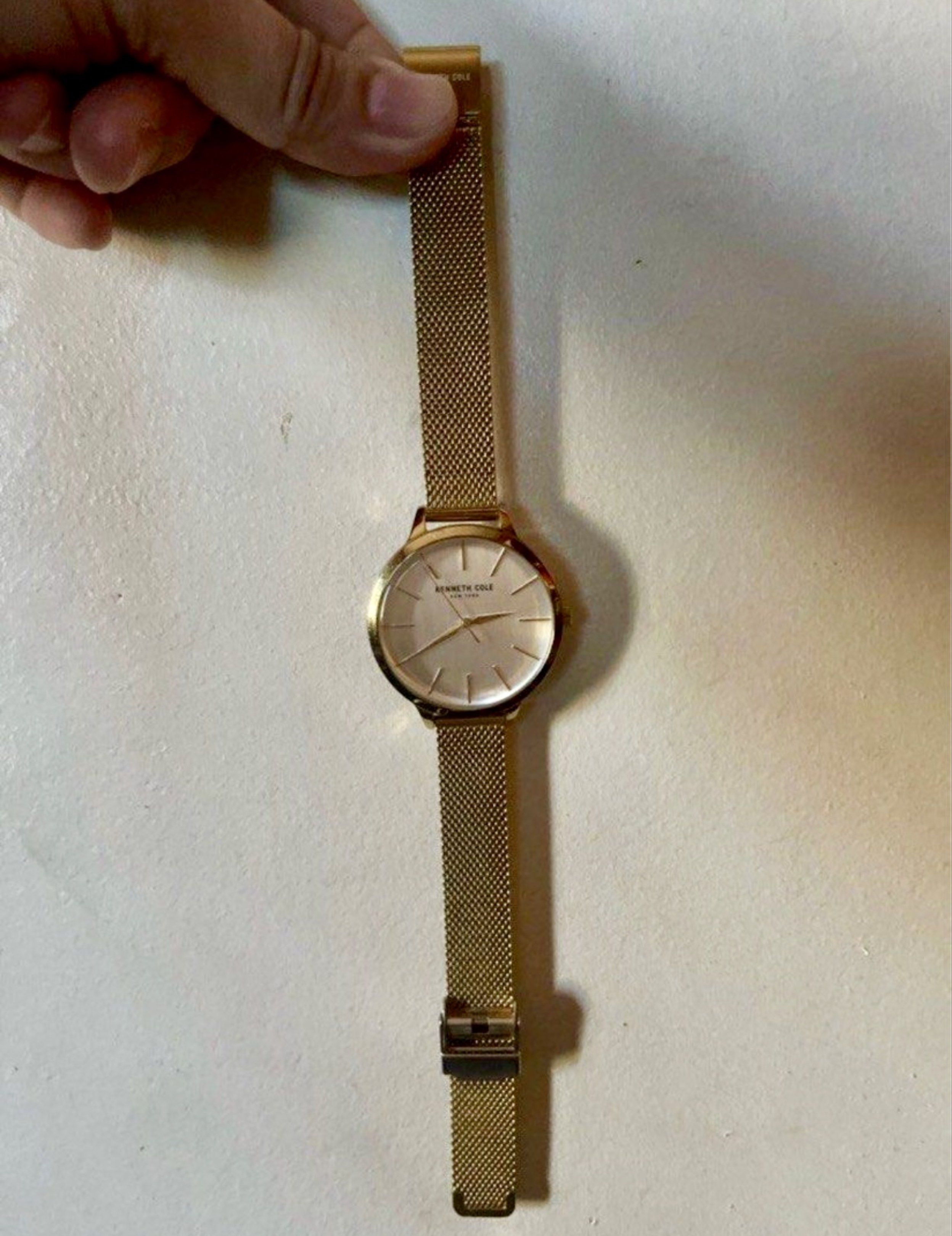 ORIG Kenneth Cole Gold Watch (Category: Women's Watches) located in Taguig. Submitted by stuffitlikeitshot (Listing ID 1420495434, Image 1). Description: - Kenneth Cole watch - Gold-toned mesh strap - Matching round face - Minimalist design - Gold-toned back with Kenneth Cole logo - Classic and stylish.