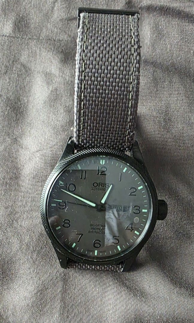 ORIS BIG Crown ProPilot Automatic Watch (Category: Men's Watches) located in Manila. Submitted by capscrot (Listing ID 1420412706, Image 3). Description: - Oris Big Crown ProPilot Automatic Watch - Black case - Grey fabric strap - Dark watch face - Luminous hands and numerals - Day and date display at 3 o'clock - Black buckle with Oris logo.