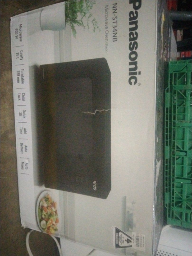 Panasonic NN-ST34NB Microwave Oven (Category: Ovens & Toasters) located in Manila. Submitted by maria123_a (Listing ID 1420455821, Image 1). Description: Panasonic NN-ST34NB microwave oven. Features 900W microwave power, 25L cavity, and a 288 mm turntable. Includes child lock, quick 30 function, auto defrost, and auto menu options. The model number is NN-ST34NB. The box is shown in the image..