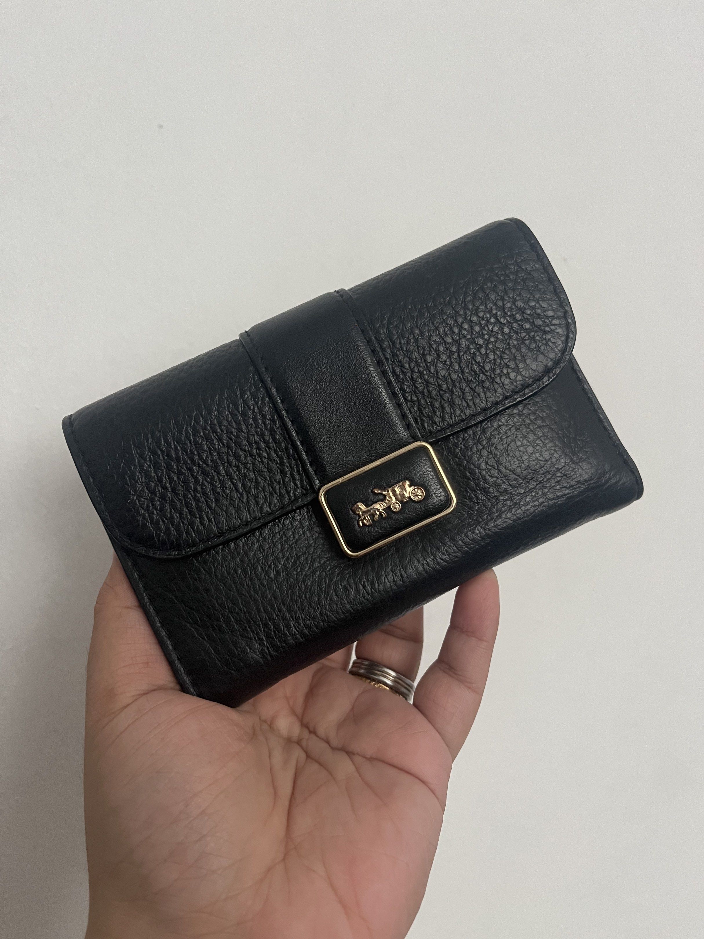 Pebbled Coach Medium Grace Wallet CC059 (Category: Luxury Bags & Wallets) located in Las Pinas. Submitted by handydandy.eg (Listing ID 1420387187, Image 1). Description: Gorgeous Coach Medium Grace Wallet in classic black pebbled leather. Its interior leather is dark burgundy/maroon. Features 1 paper bill compartment, at least 8 card slots, 1 id/photo insert, 1 zipper pocket, and 1 back slot. Closure is snap button. No major flaws, even the rubbe