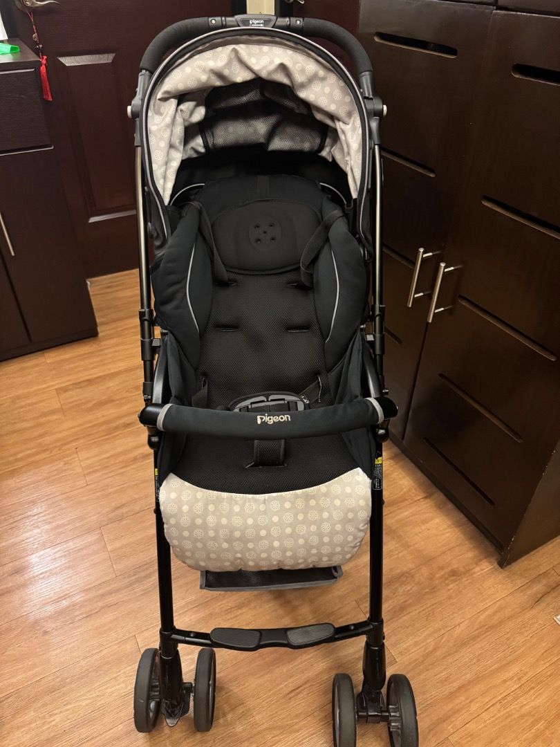 Pigeon Stroller (Category: Strollers) located in Manila. Submitted by airuairu49787 (Listing ID 1420525870, Image 1). Description: Pigeon stroller features a black frame and seat with a patterned canopy and seat base. It has a padded seat with a safety harness and a front bar. The stroller has four wheels and a handle for easy maneuvering. Wheels have lock both front and back. Selling because decluttering. .