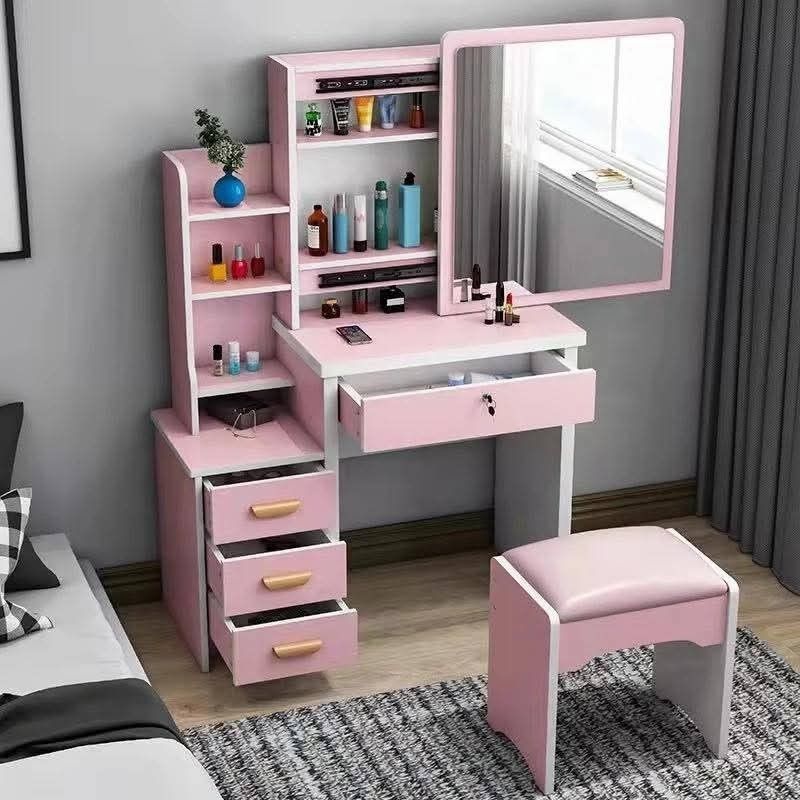 Pink Vanity Table with Mirror and Stool (Category: Tables & Sets) located in Manila. Submitted by yzlshop (Listing ID 1420360470, Image 3). Description: - Pink vanity table with matching stool. - Built-in mirror. - Multiple shelves and drawers for storage. - Ideal for makeup and accessories. - Sleek, modern design. - Dimensions in images..