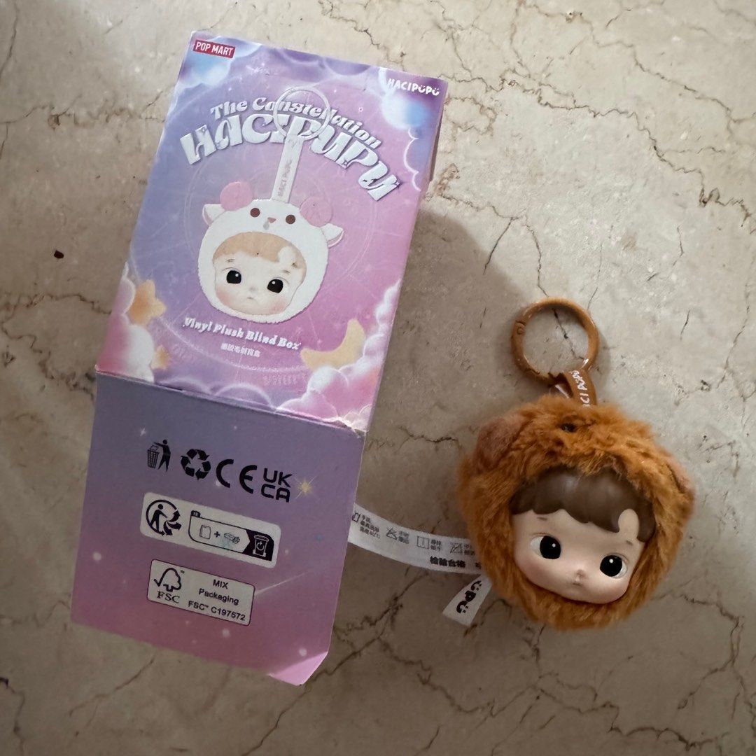 Pop Mart Hacipupu The Constellation Keychain (Category: Designer & Blind Box Toys) located in Mandaluyong City. Submitted by declutter.pjt (Listing ID 1420378372, Image 1). Description: - Pop Mart Hacipupu The Constellation Vinyl Plush Blind Box keychain - Features a Hacipupu figure - Adorable design with a brown furry hood - Includes the original box - Blind box item: design is a surprise!.