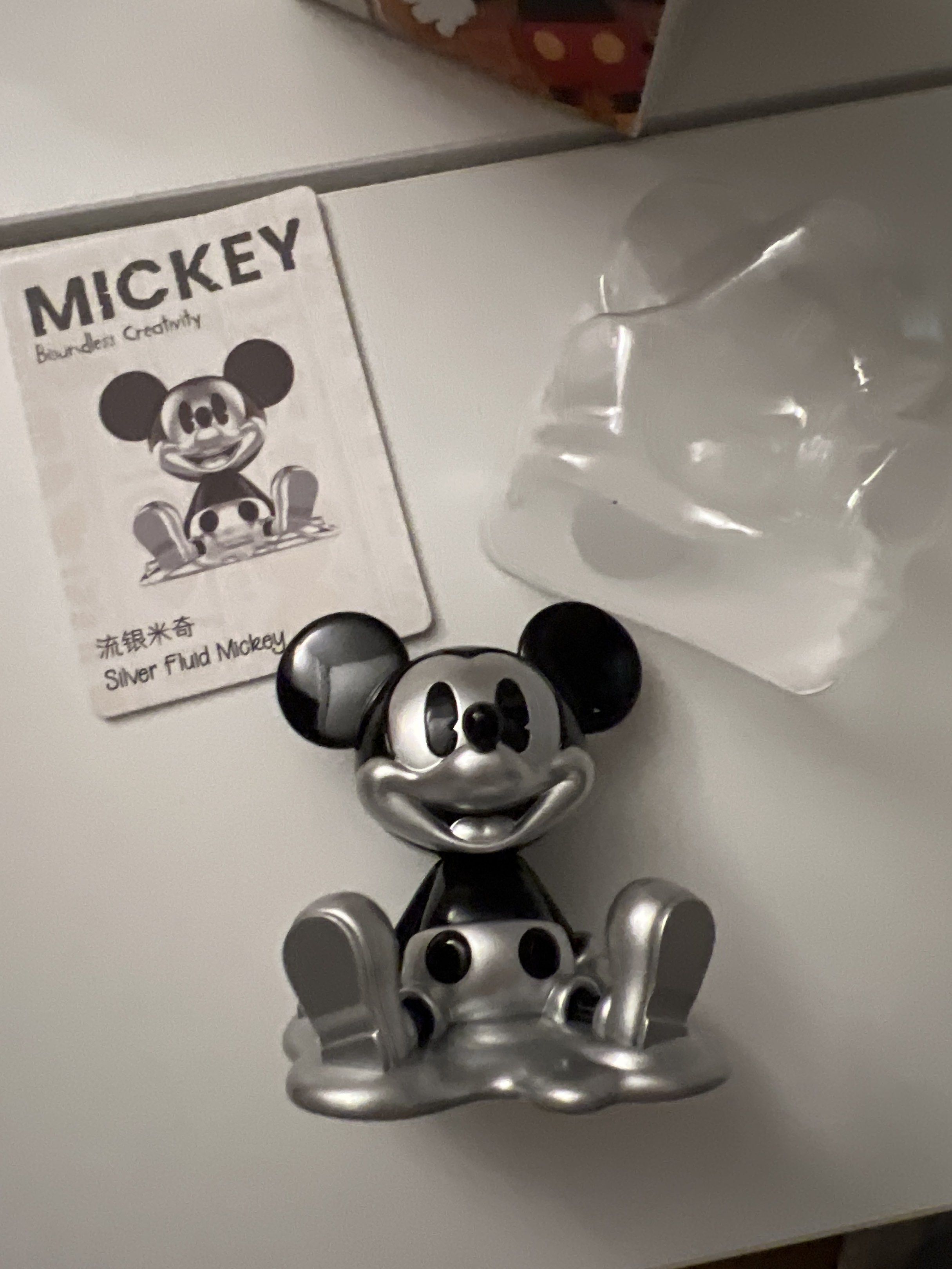 POP MART Mickey Silver Fluid Figure blind box (Category: Designer & Blind Box Toys) located in Manila. Submitted by fitmeph (Listing ID 1420495245, Image 2). Description: - POP MART Mickey Silver Fluid figure - From the Boundless Creativity series - Silver and black design - Includes original box and card - Unopened blind box figure - Brand new.