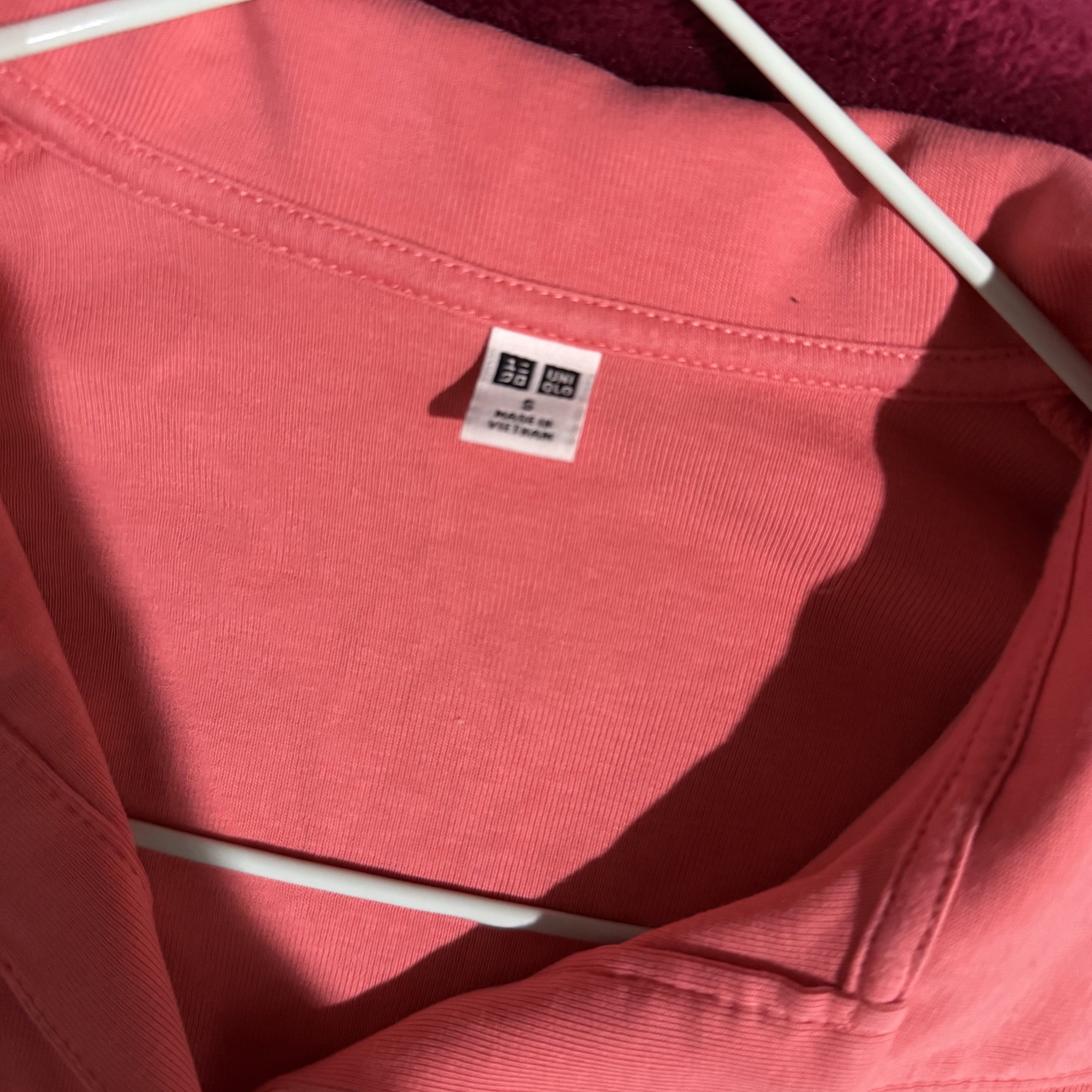 Preloved: Uniqlo Polo Shirt (Category: Shirts) located in Antipolo. Submitted by bookcycledph (Listing ID 1420536451, Image 2). Description: - Uniqlo coral polo shirt - Size: S - Features a collared neckline - Short sleeves - V-neck design - Made in Vietnam.