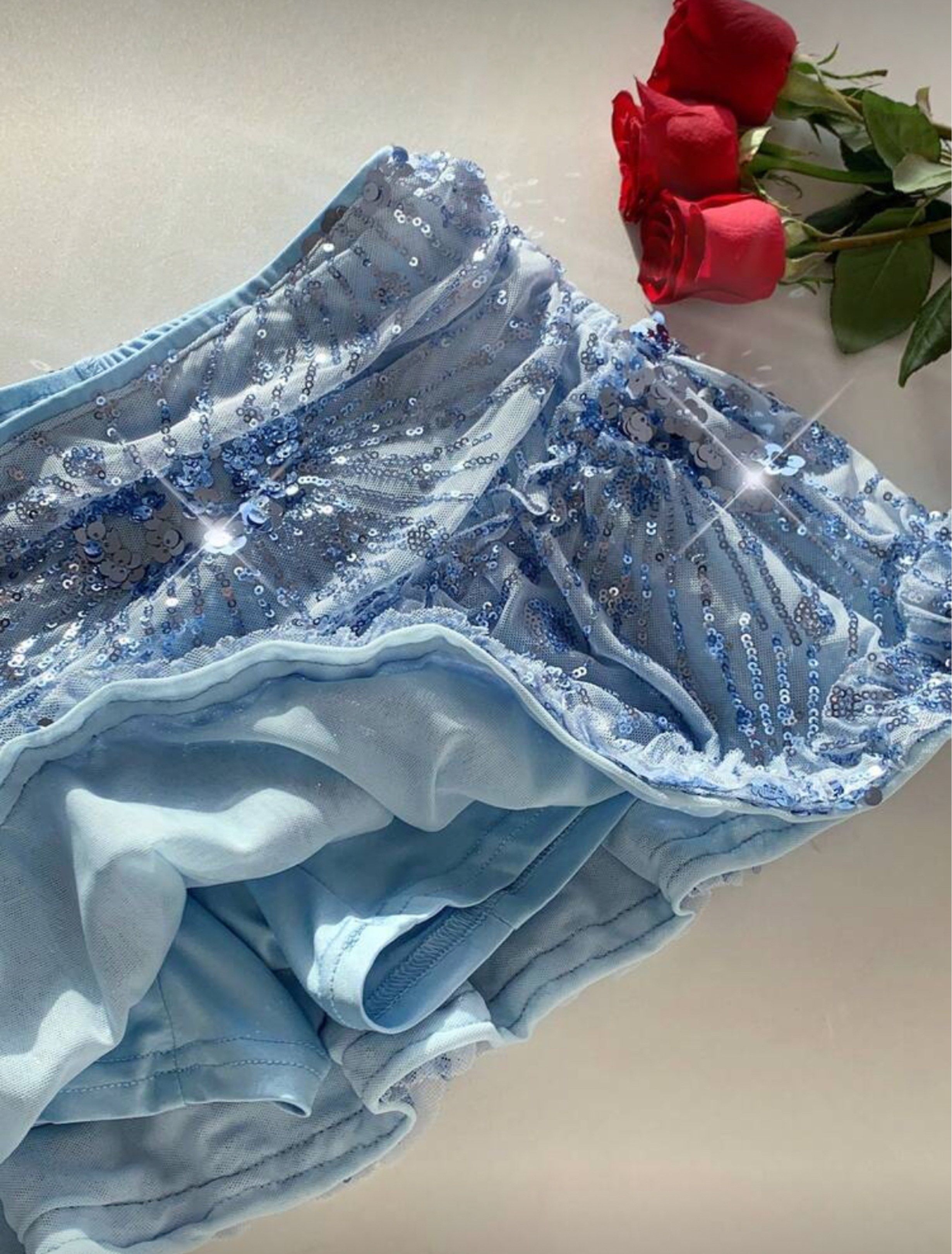 Shein Sequin Ruffle Mini Skirt (Category: Skirts) located in Quezon City. Submitted by jagermasterrr (Listing ID 1420525117, Image 3). Description: - light blue mini skirt - sequin detailing - ruffled hem - never been worn.