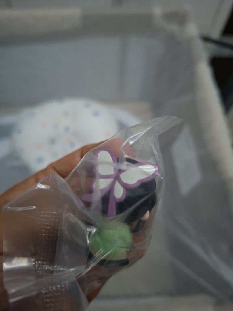 Shinobu Gashapon (Category: Other Home Decor) located in Mandaluyong City. Submitted by TheRoyalCollection (Listing ID 1420358217, Image 2). Description: - Anime figurine - Character with black hair and purple eyes - Comes in original plastic packaging - Small, collectible size - Detailed design visible.