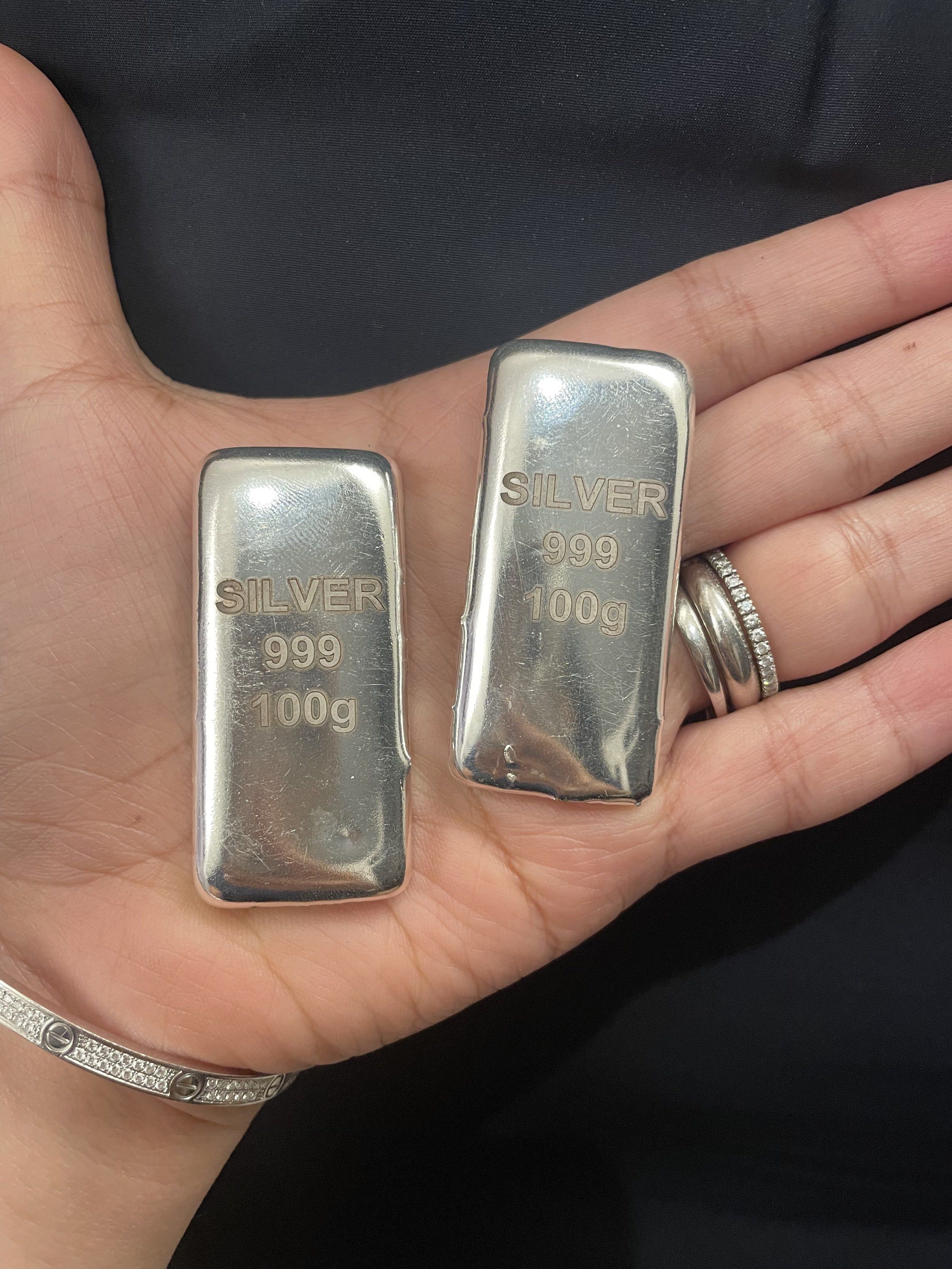 Silver 999 100g Bar (Category: Currency) located in Rizal. Submitted by titaknows (Listing ID 1420397733, Image 2). Description: - 1 silver bar - Each bar: 100g, 999 silver - Rectangular shape - Shiny, reflective surface - Clear markings.