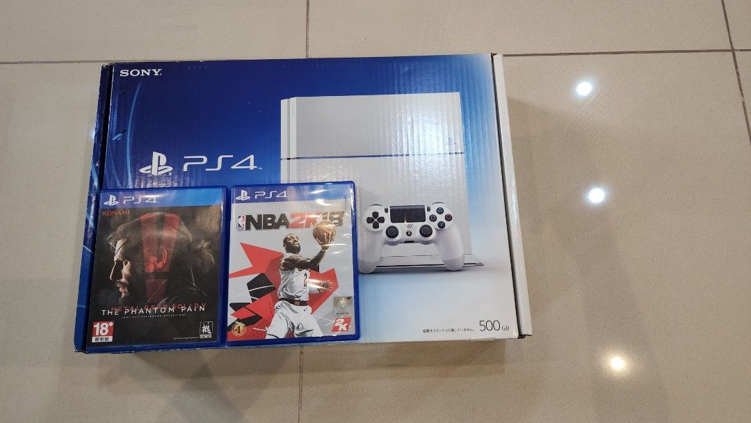 Sony PlayStation 4 500GB with Games (Category: PlayStation) located in Makati City. Submitted by carwtan90 (Listing ID 1420356350, Image 1). Description: - White Sony PlayStation 4 500GB console - Includes a white controller - Comes with the original box - Includes all necessary cables - Two games included: "Metal Gear Solid V: The Phantom Pain" and "NBA 2K15" - Ready to play immediately!.