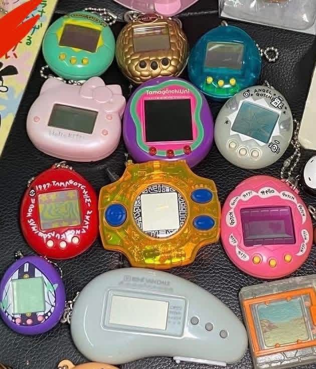 TAMAGOTCHI Bandai - Virtual Pets Angel Gotchi, HK / Hello Kitty, SANRIO, 1996, w/ markings all tested & working (Category: Interactive Toys) located in Marikina City. Submitted by anikanik. (Listing ID 1420493437, Image 1). Description: TAMAGOTCHI Bandai - Virtual Pets Angel Gotchi, HK / Hello Kitty, SANRIO, 1996, w/ markings all tested & working WYSIWYG 1250 each, all 3 for 3000.
